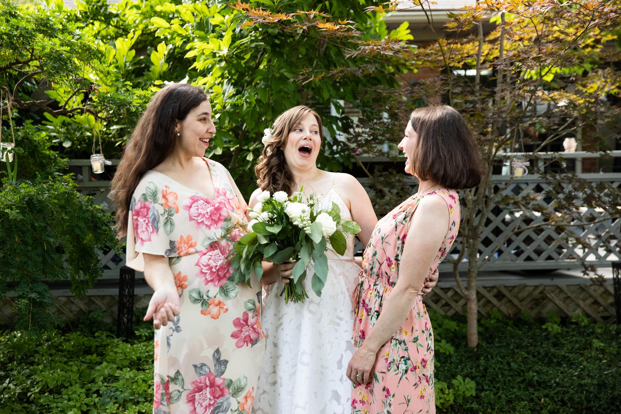 bride and friends laughing outside.jpg