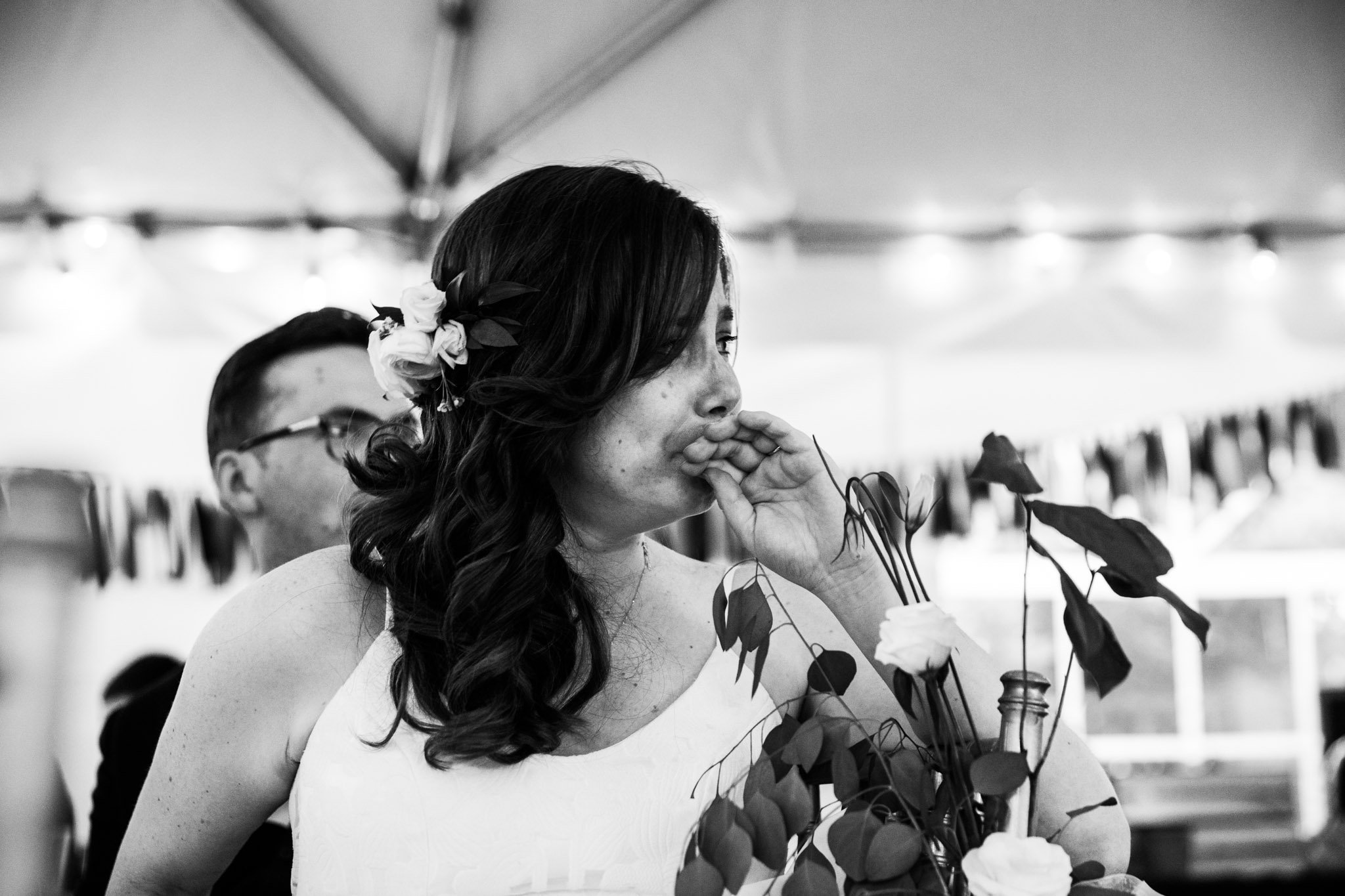 close up of bride with her hand covering her mouth - black and white wedding photography.jpg