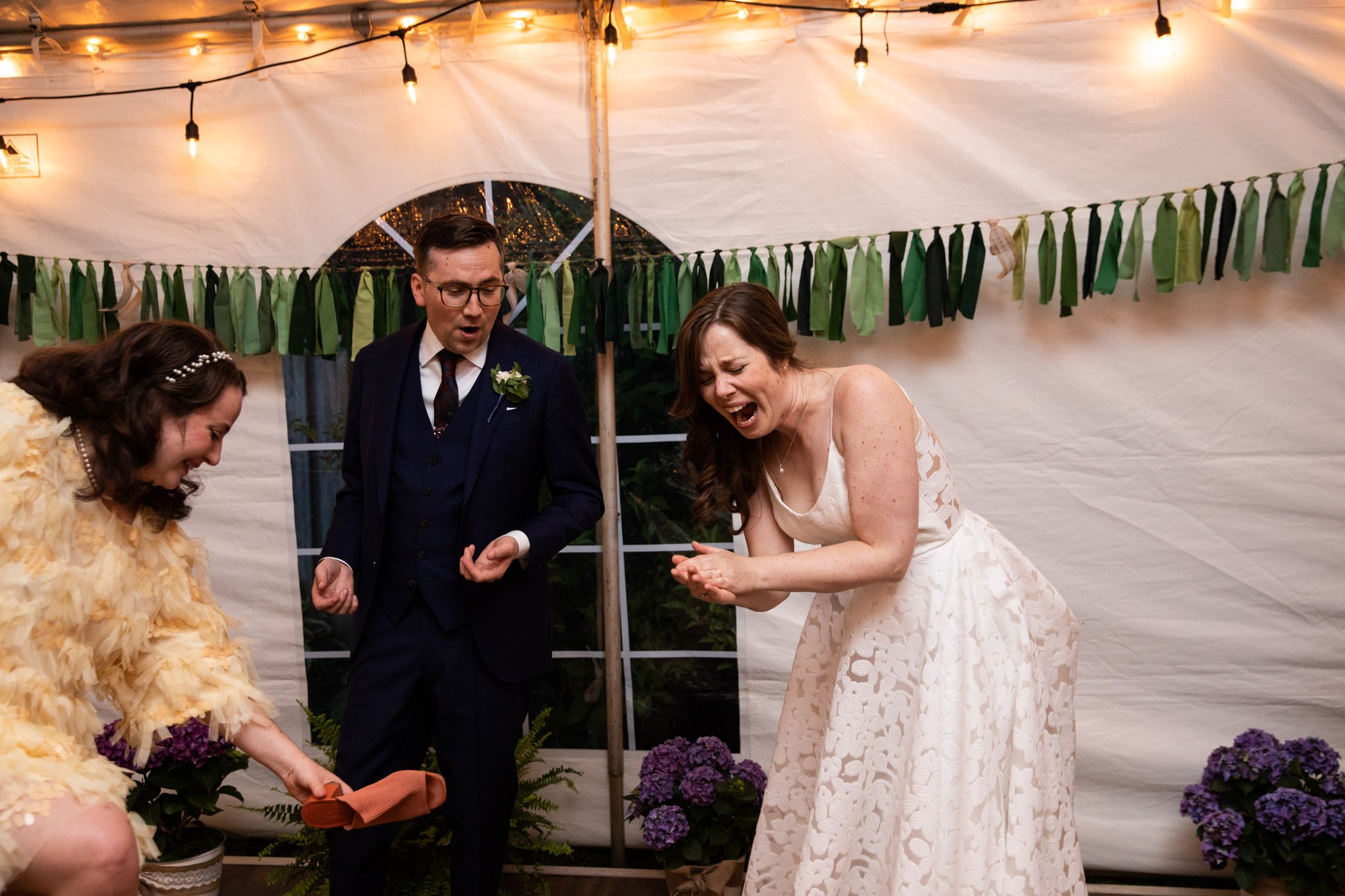 bride and groom laughing on the dance floor.jpg