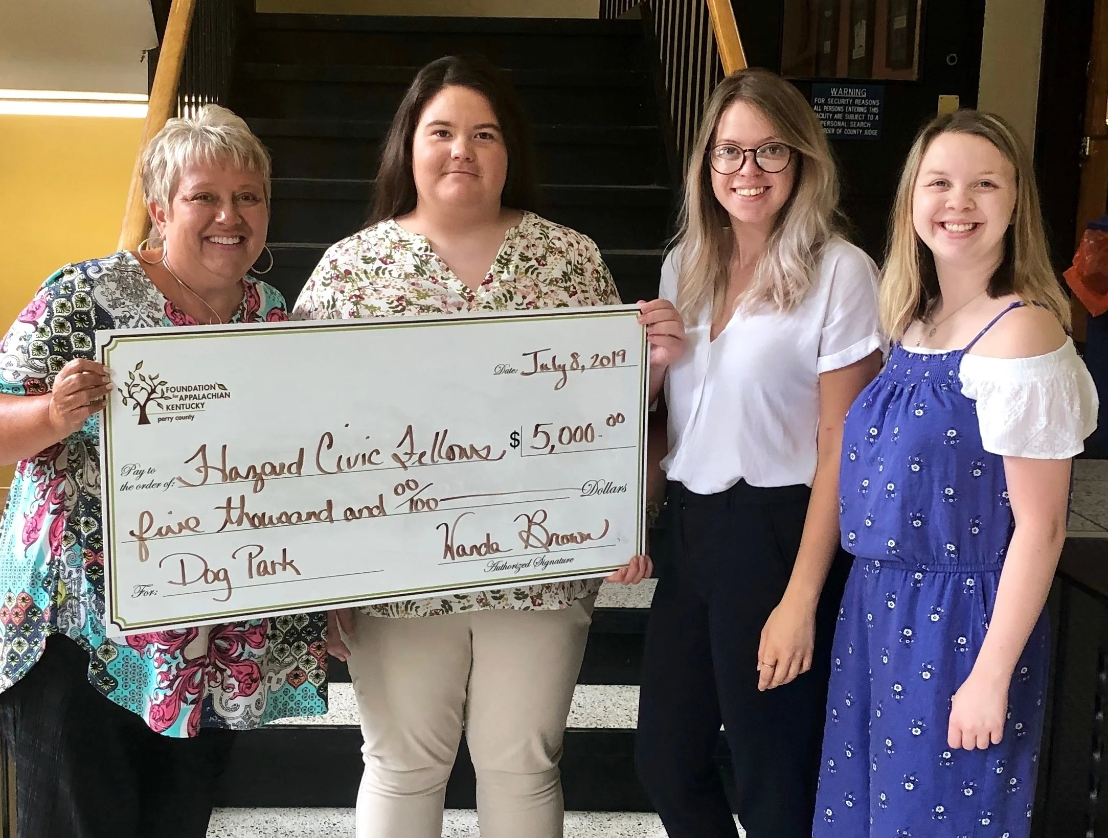 Wanda Brown- Co-Chair of the Perry County Community Foundation presenting a $5,000 check to the Hazard Civic Fellows to aid in completing a dog park.
