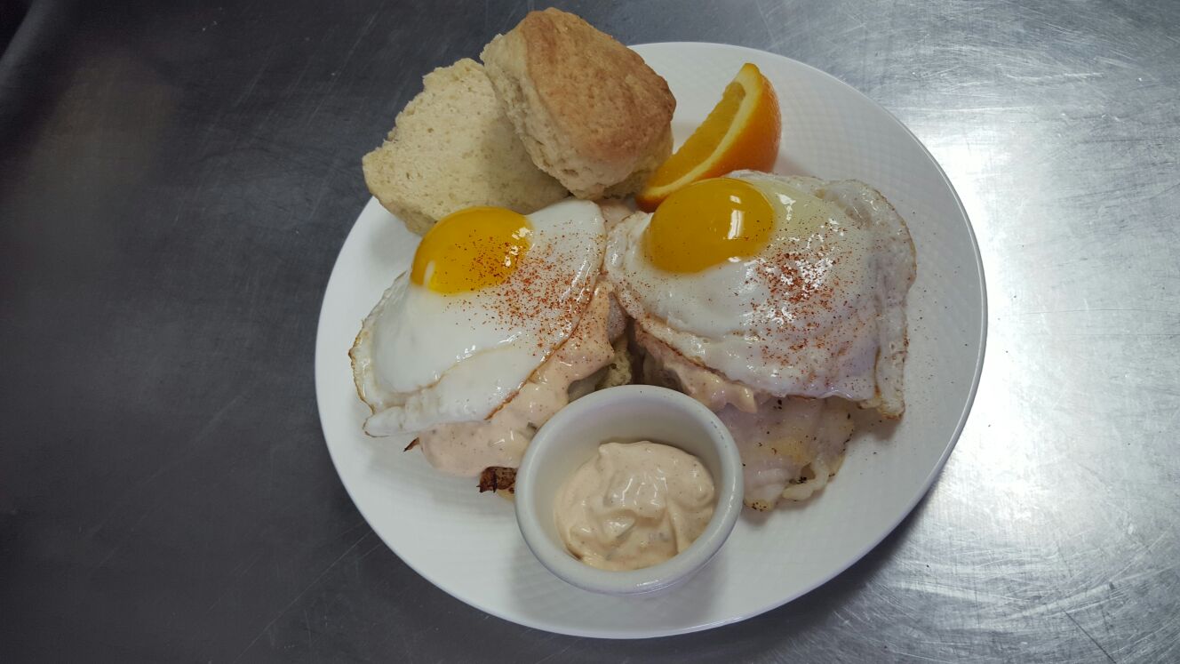 Homemade biscuits served with pan fried Basa fish topped with tartar sauce and 2 eggs cooked to order. 