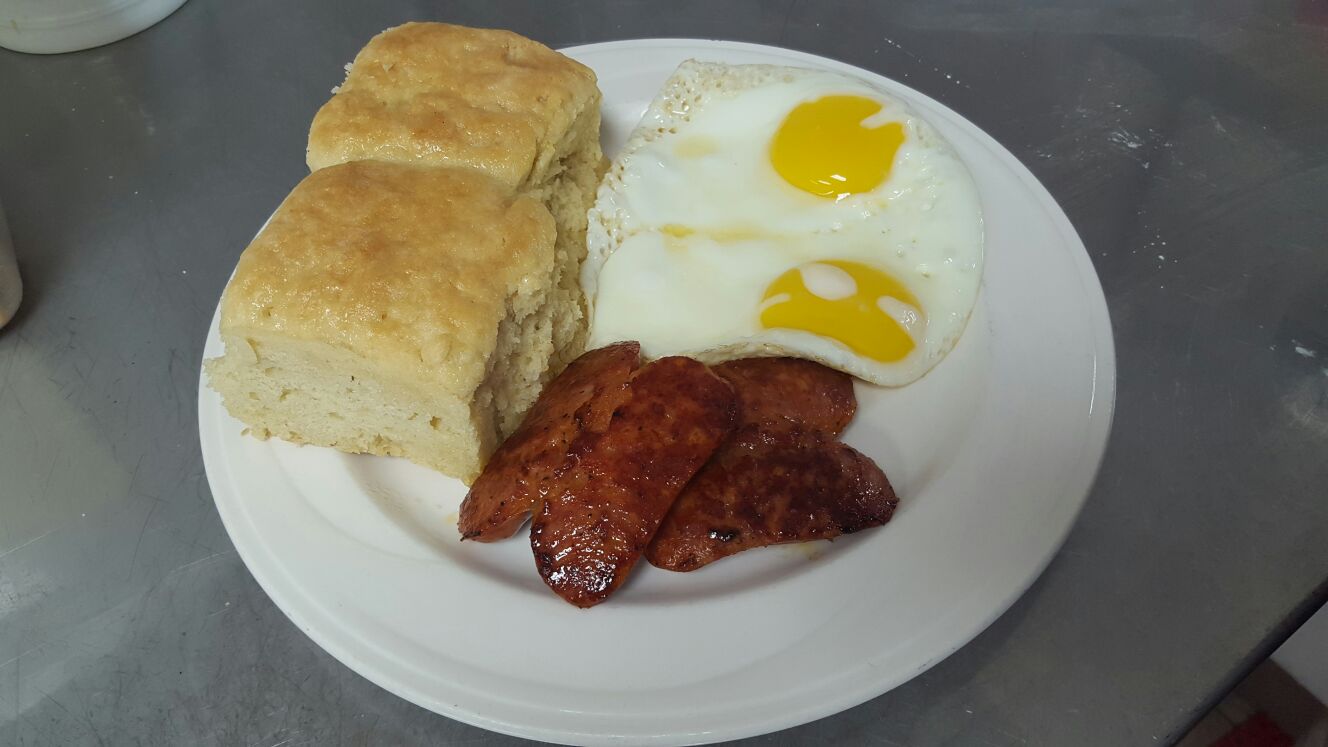 2 Homemade Biscuits served with 2 eggs cooked to order and a choice of meat. 