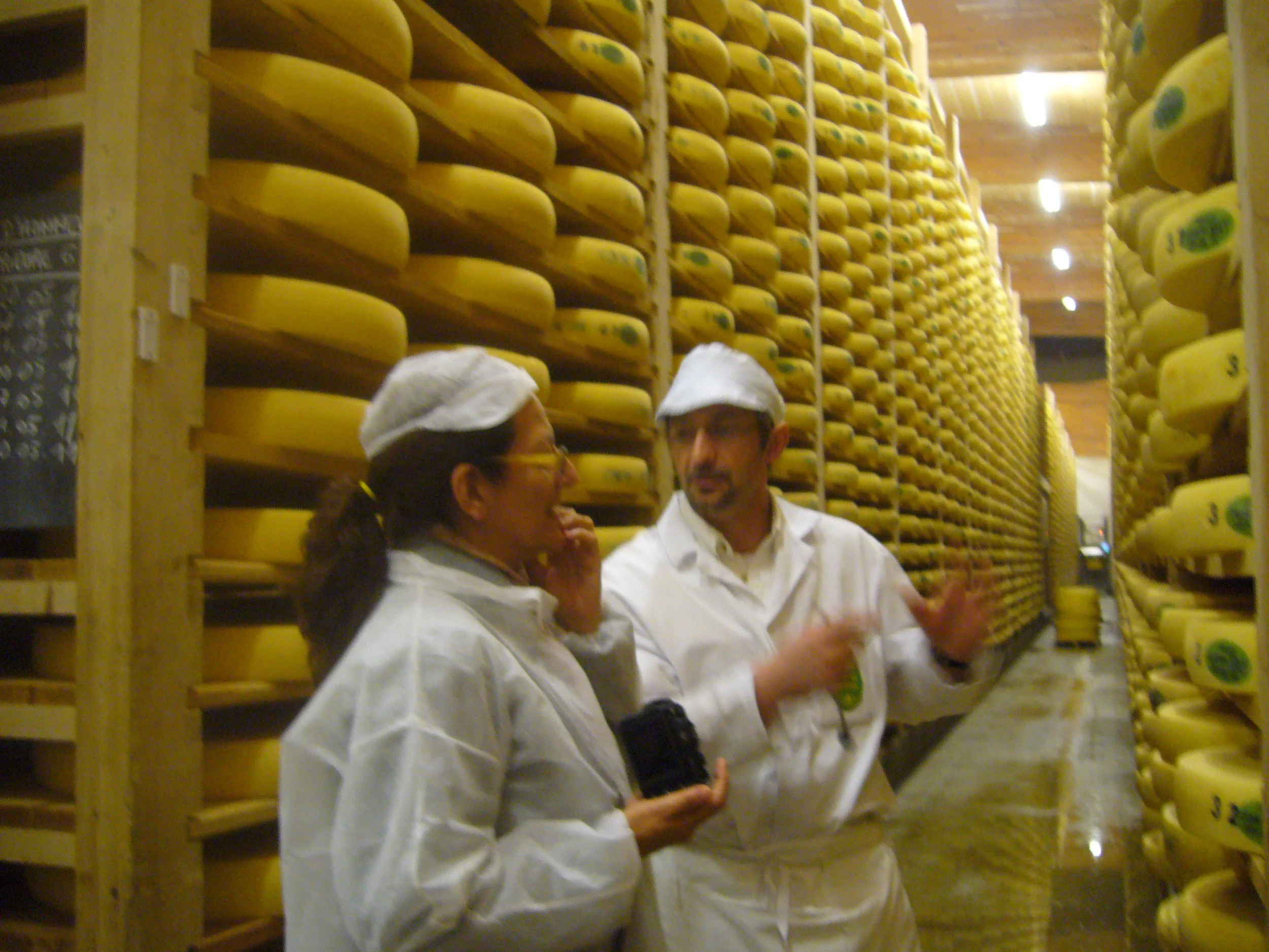 Benjamin's cheese mentor Daphne Zepos amongst thousands of wheels of Comte