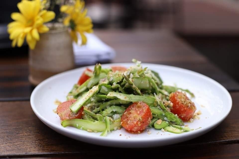 Asparagus season is in full swing and you do not want to miss our Asparagus Salad! Thinly sliced, crisp asparagus, with fava beans and tomato, tossed in a tangy citrus dressing,this will be your new favorite way to enjoy the season! 
.
Asparagus Sala