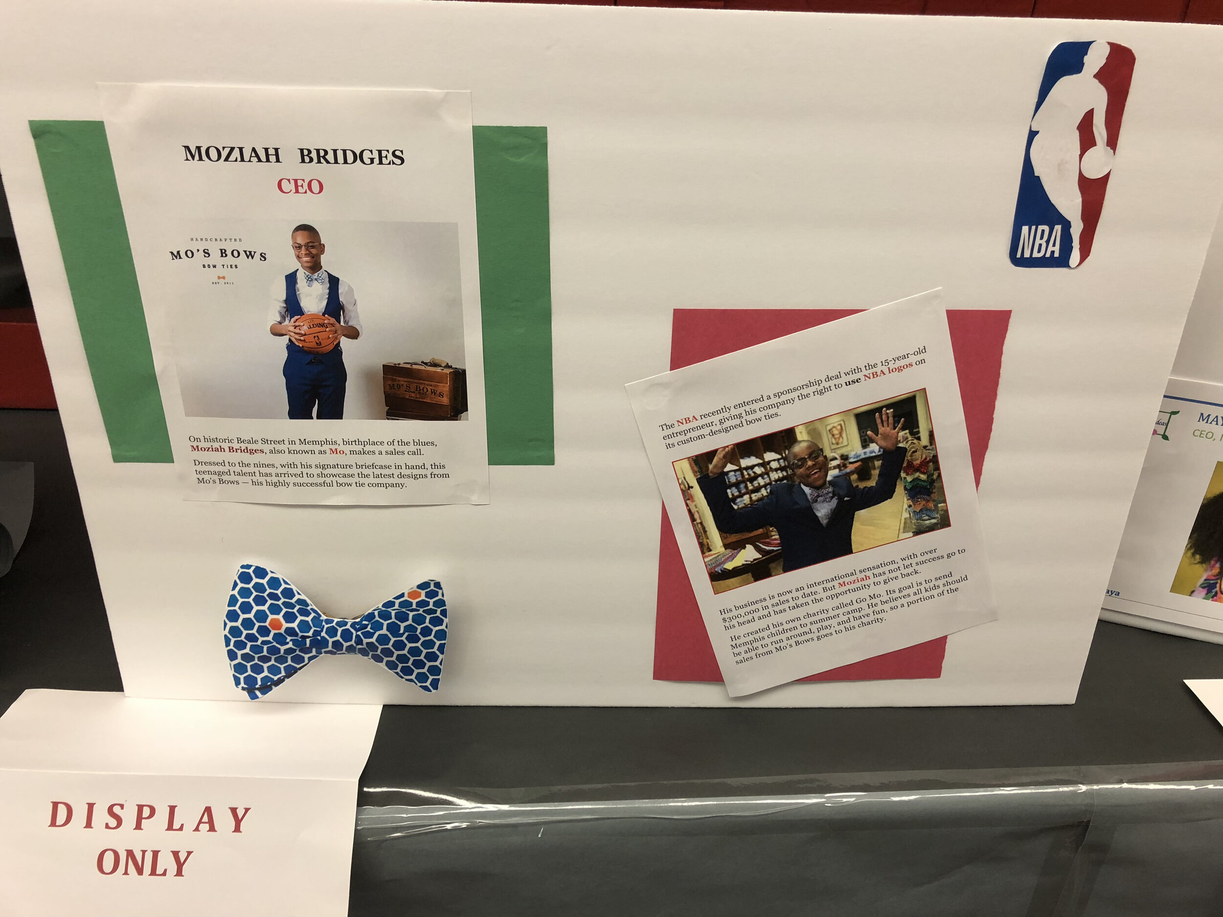  Poster display of Moziah Bridges, teen with his mother created a bow tie business which received a contract from the NBA.