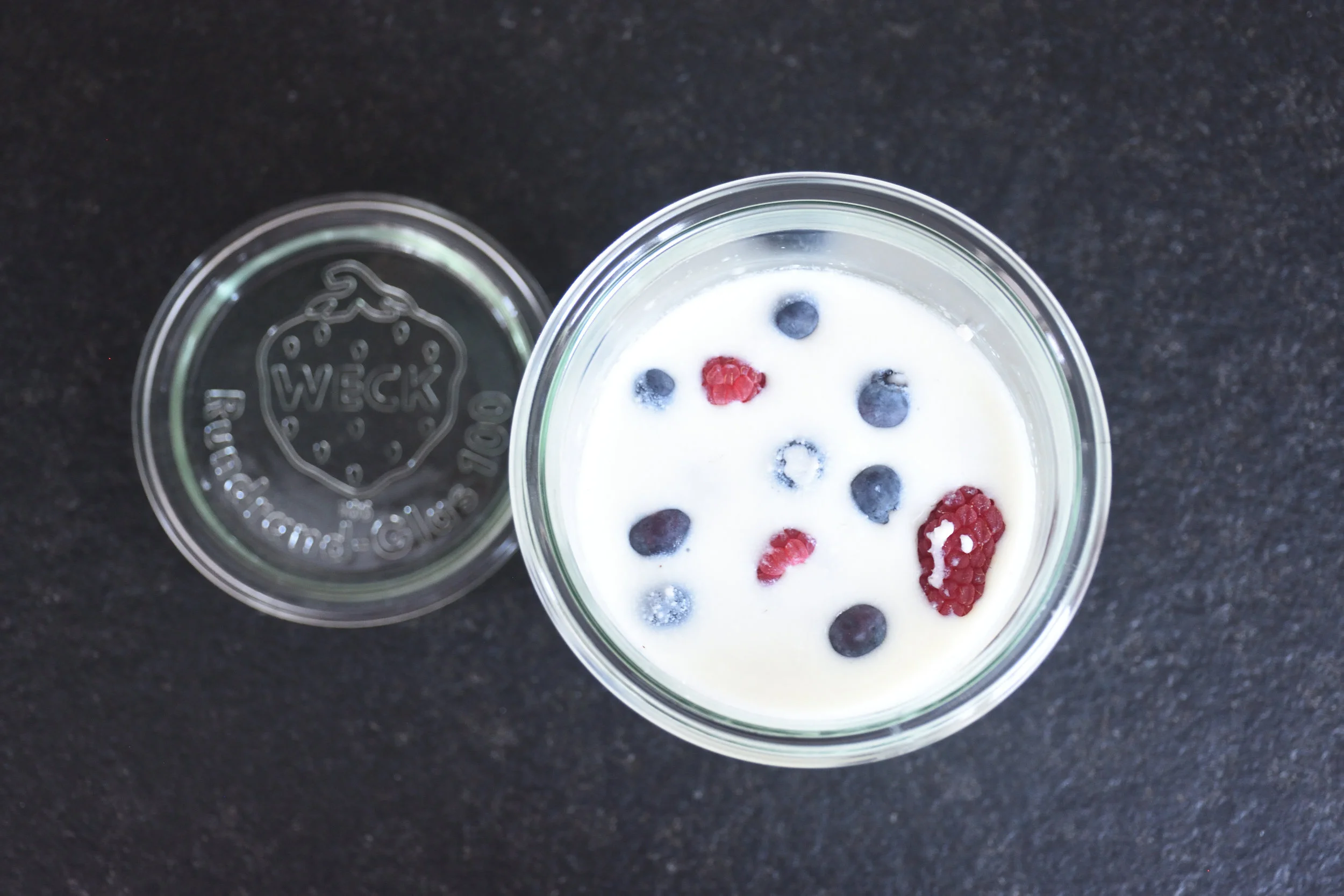 Starting a second fermentation with blueberries and respberries