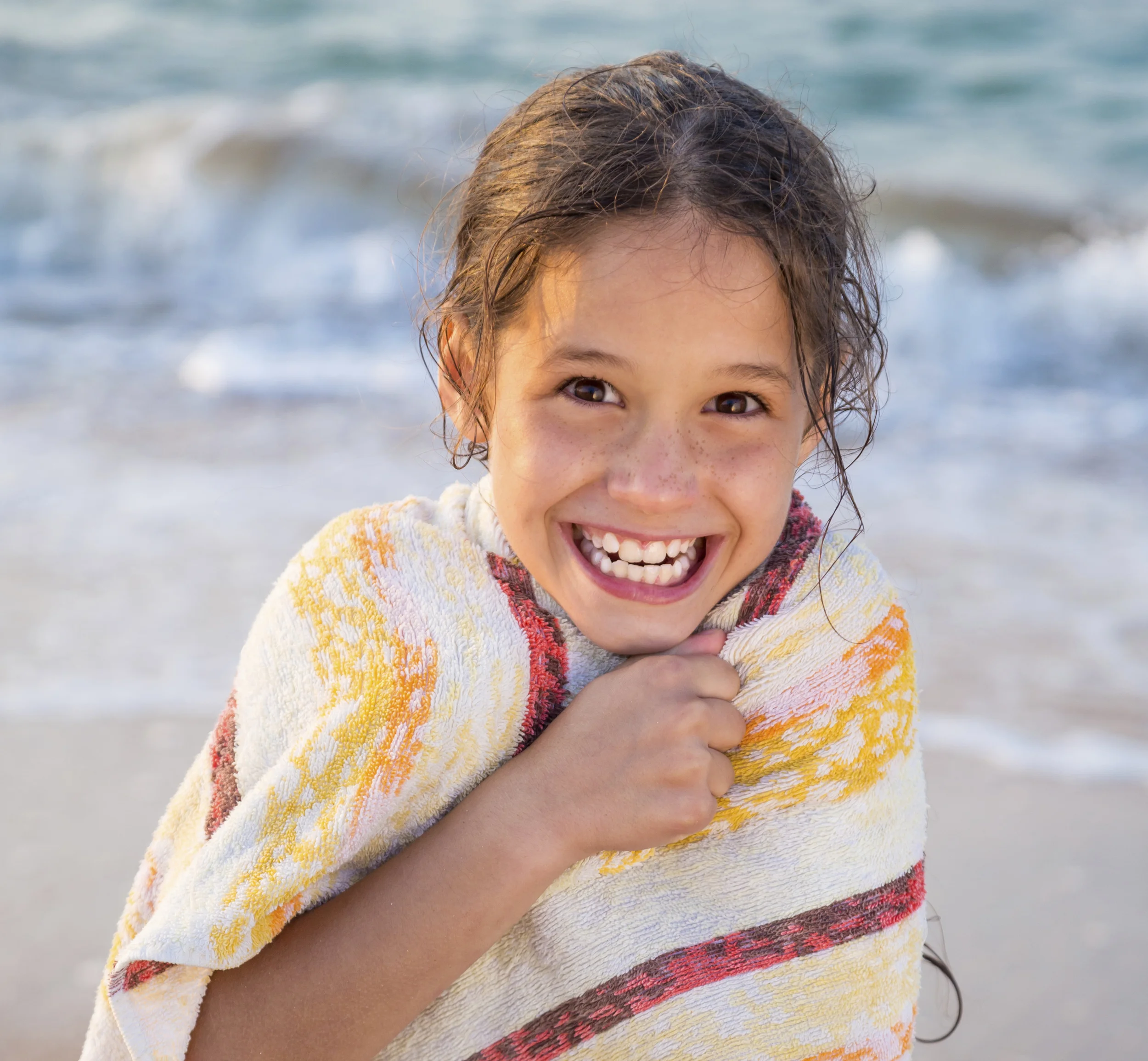 girl in towel bathing suit by beach cropped 465249885.jpg