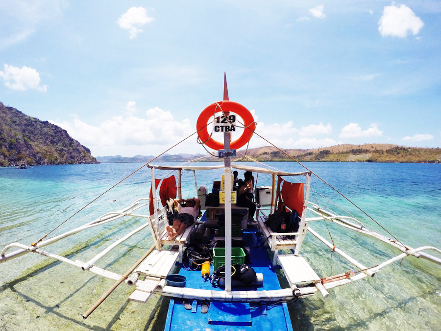 Our dive banca parked on Sangat Island for the East Tangat Wreck.