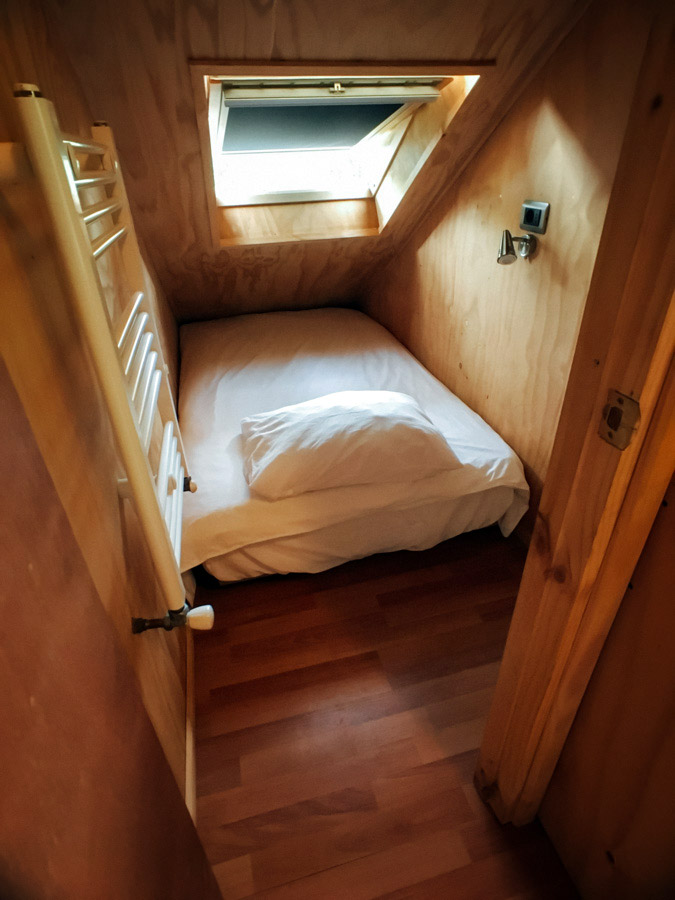  One of the single capsule rooms at hostel  French Andes . 