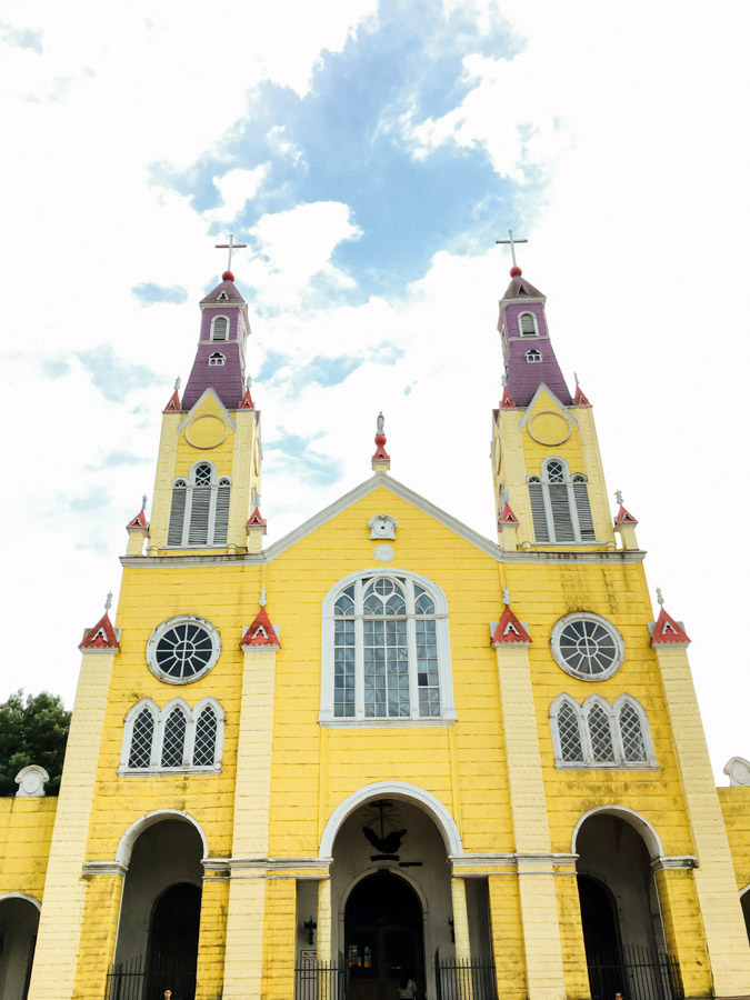  Likely the most prolific structure on the Chiloé church circuit, is this bright yellow building on Castro’s main square: Iglesia San Francisco. A series of wooden churches much smaller and humbler than this one, dot the island, and represent the per