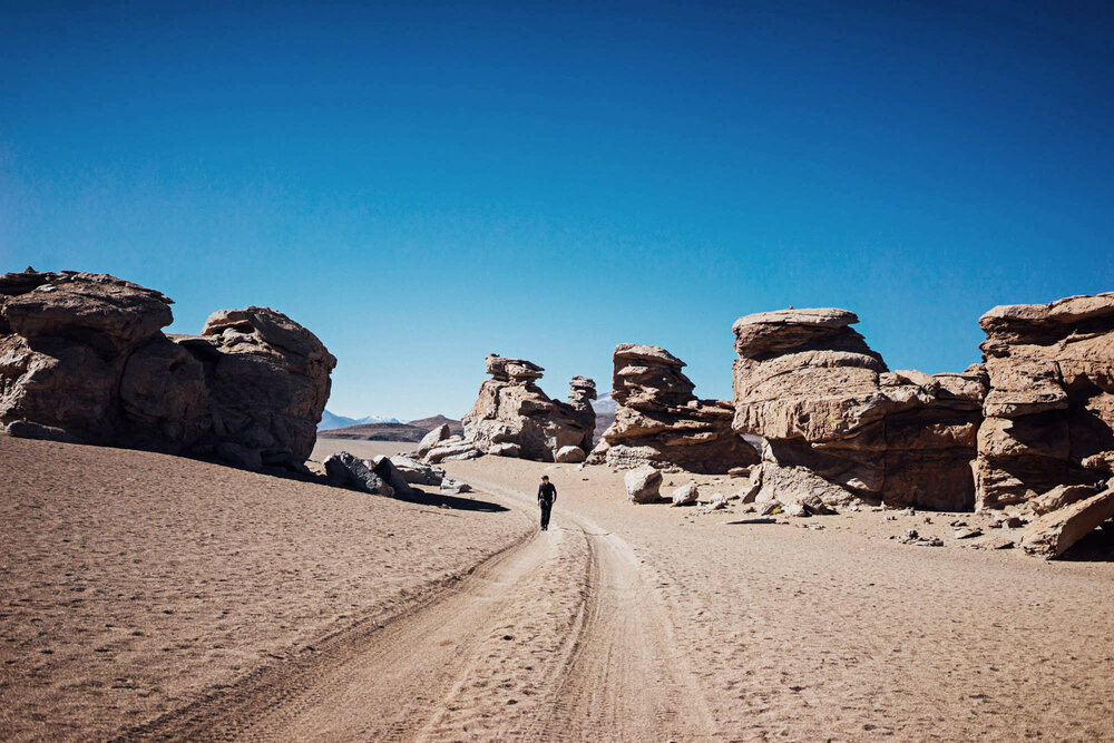  Walking through rock formations in the Siloli Desert. 