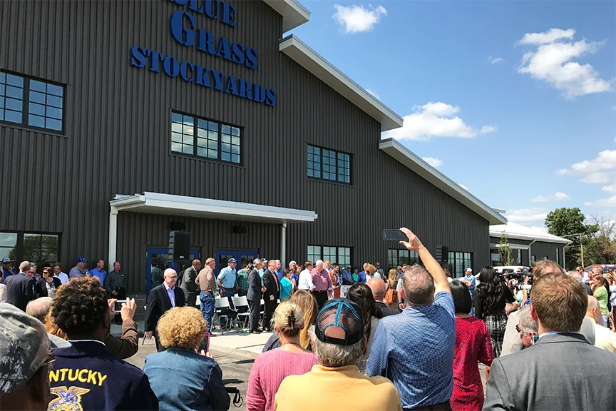 Jim Gray, Mayor of Lexington and Gene Barber, Senior Partner of BGS prepare to cut the ribbon for the new Blue Grass Regional Marketplace.