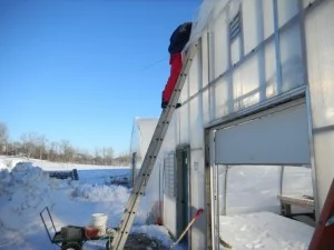 Buddy tacking the plastic down with wiggle wire