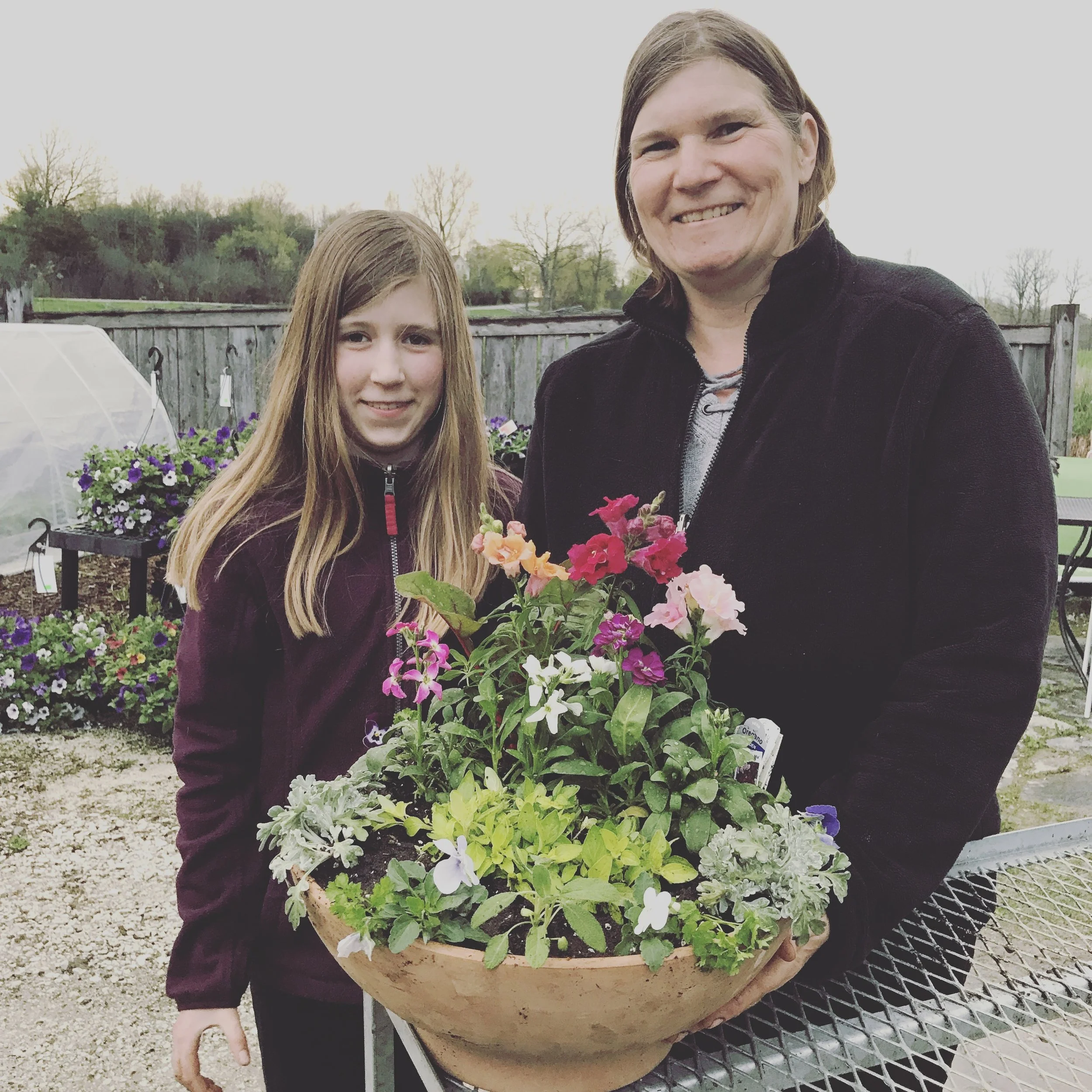 Heidi and Eliza made this pefect pot with parsley, sage, violas, snapdragons and stock. I love the way it steps up gradually from low to high. And they have herbs in there that will look great for a few weeks and then can be planted out into the garden or other pots. It is a living creation. 