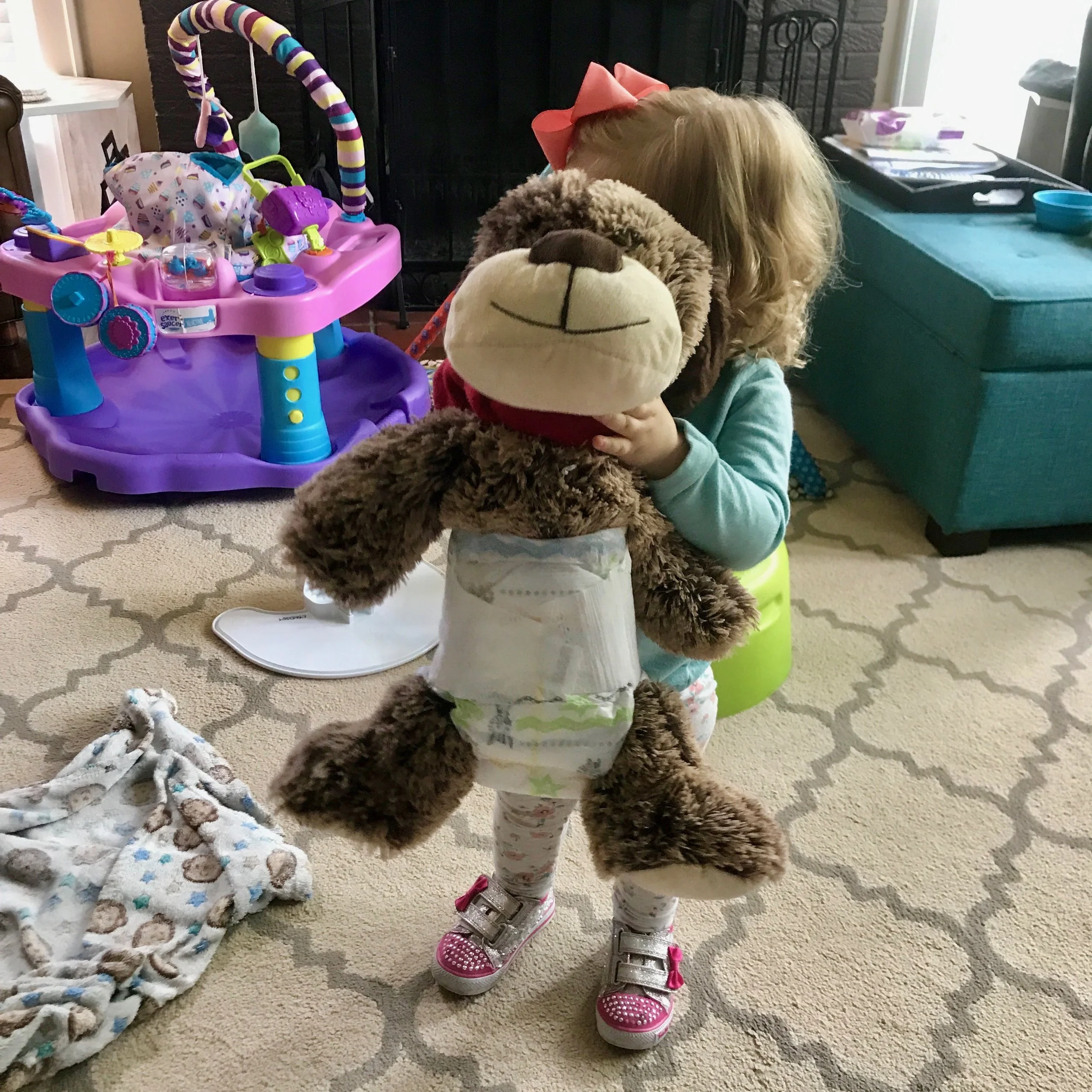 Little Mama loves putting diapers on all the stuffed animals.&nbsp;