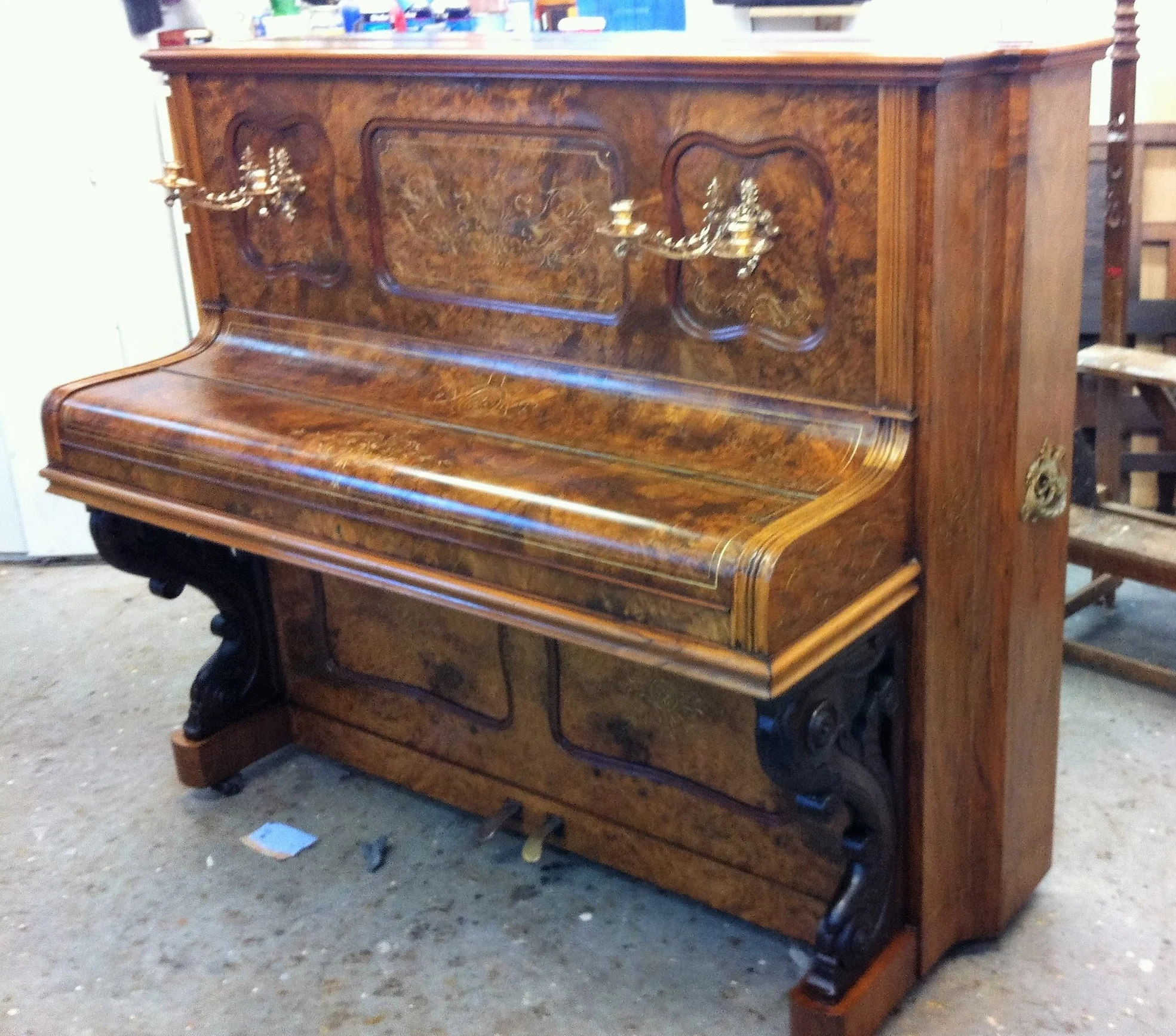 Musical Instrument Restoration:&nbsp;Upright walnut piano, veneer repairs done, gilded details restored and french-polished.