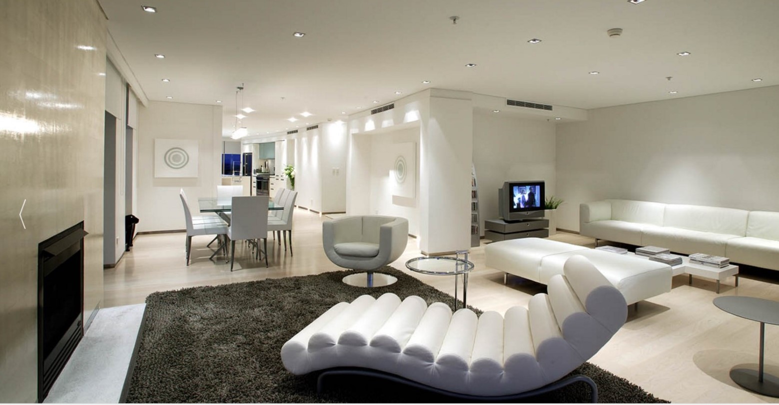 Sterling silver-leaf is applied to this fireplace surround (left in picture). This award winning Auckland apartment is designed by Archimedia Architects.