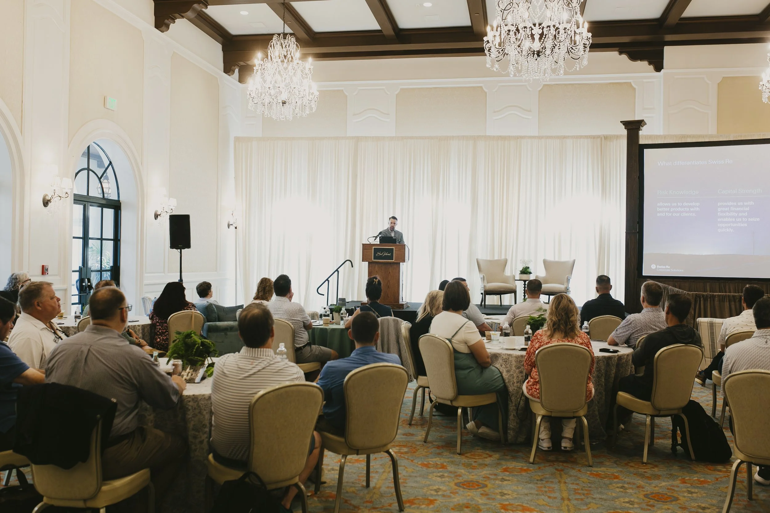 Breakout session in a chandelier ballroom during the Swiss Re producer conference at Sea Island