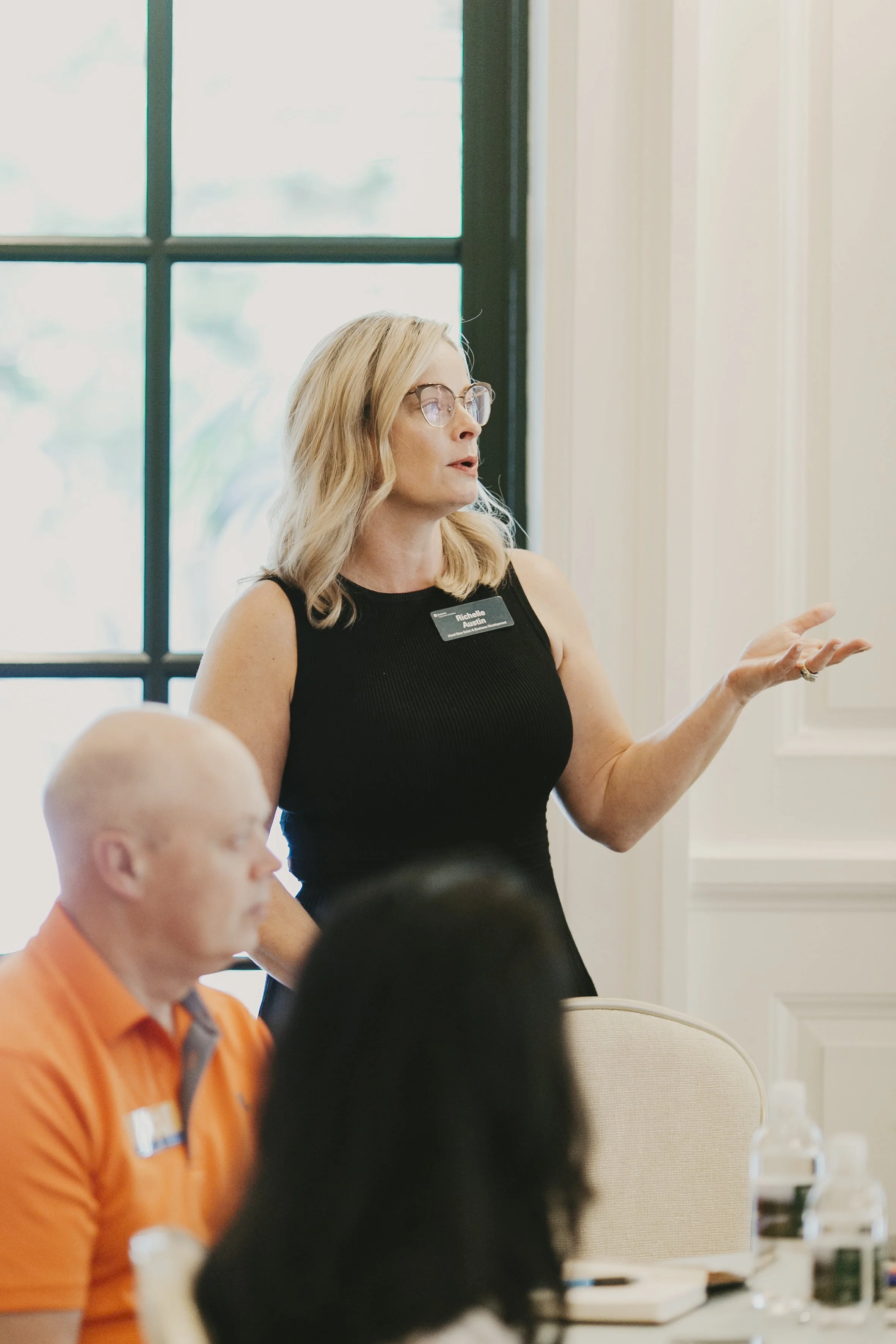 Presenter speaking to a breakout room during the Swiss Re producer conference at Sea Island