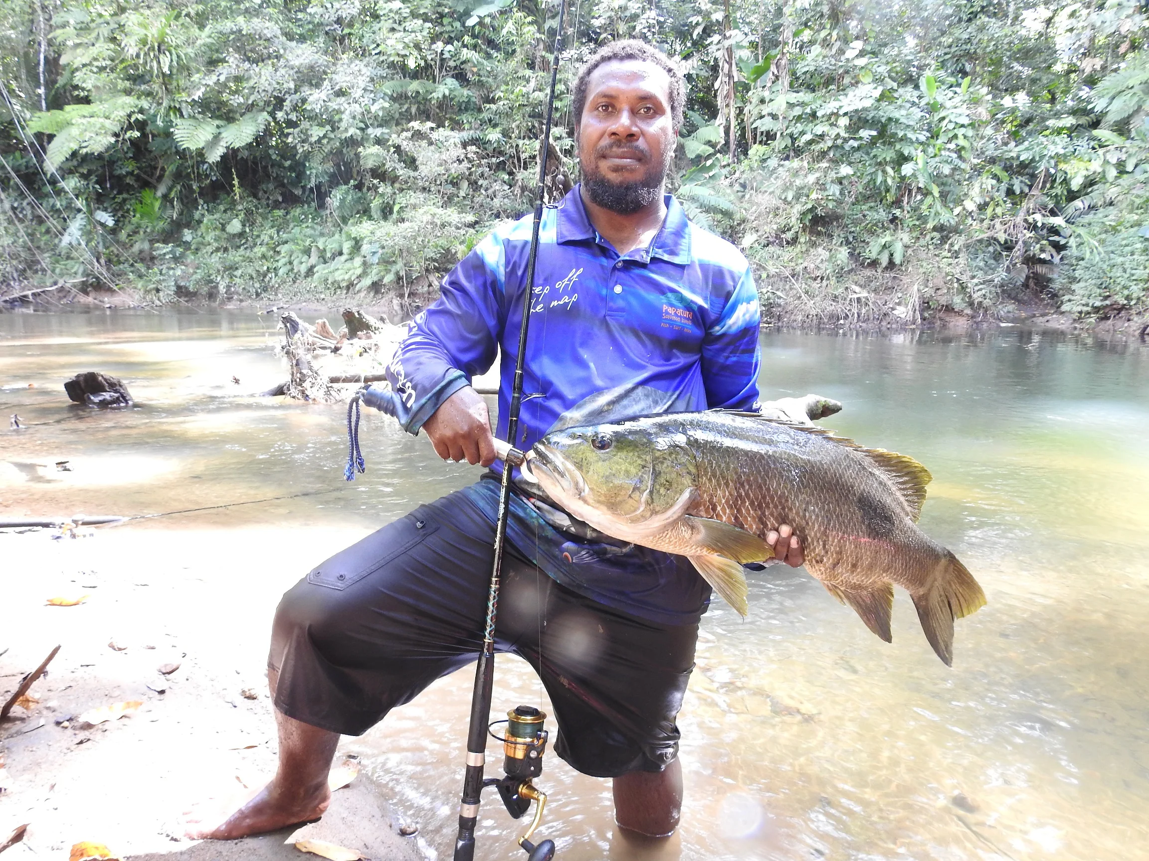 eric with spottail.JPG