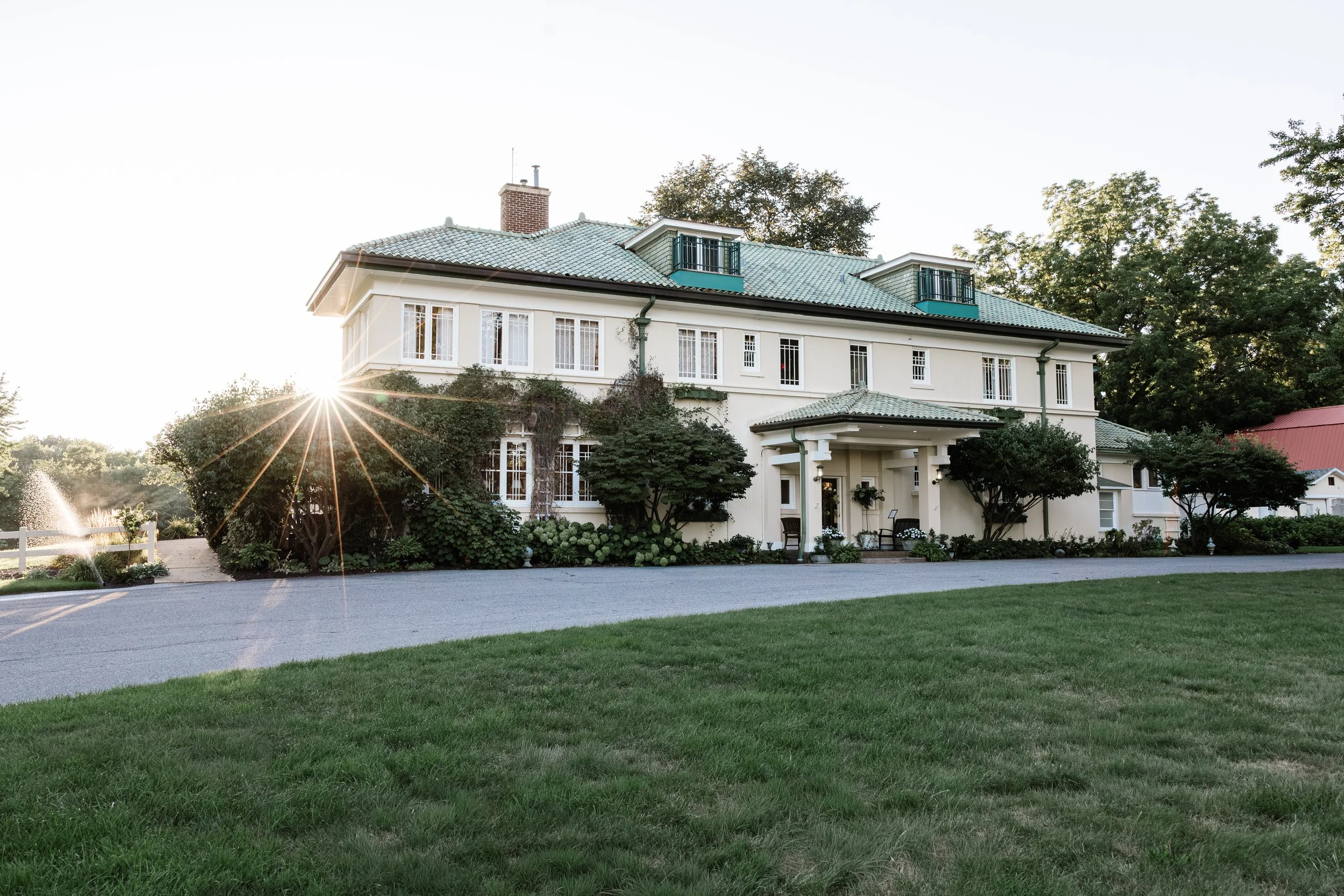 A beautiful european garden estate wedding venue in saugatuck michigan at sunset