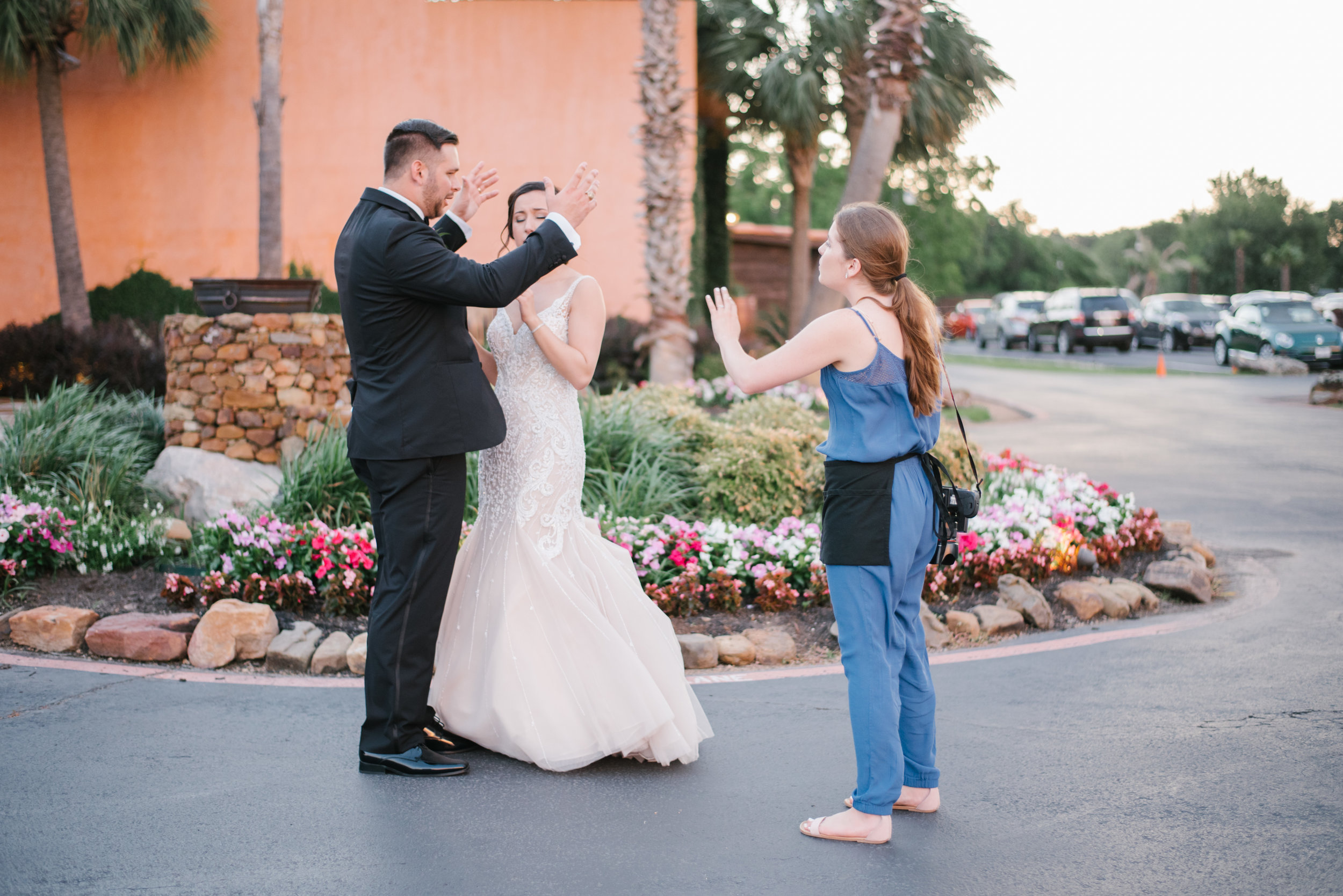 Looks like I am fighting with the groom… Just posing them!! LOL
