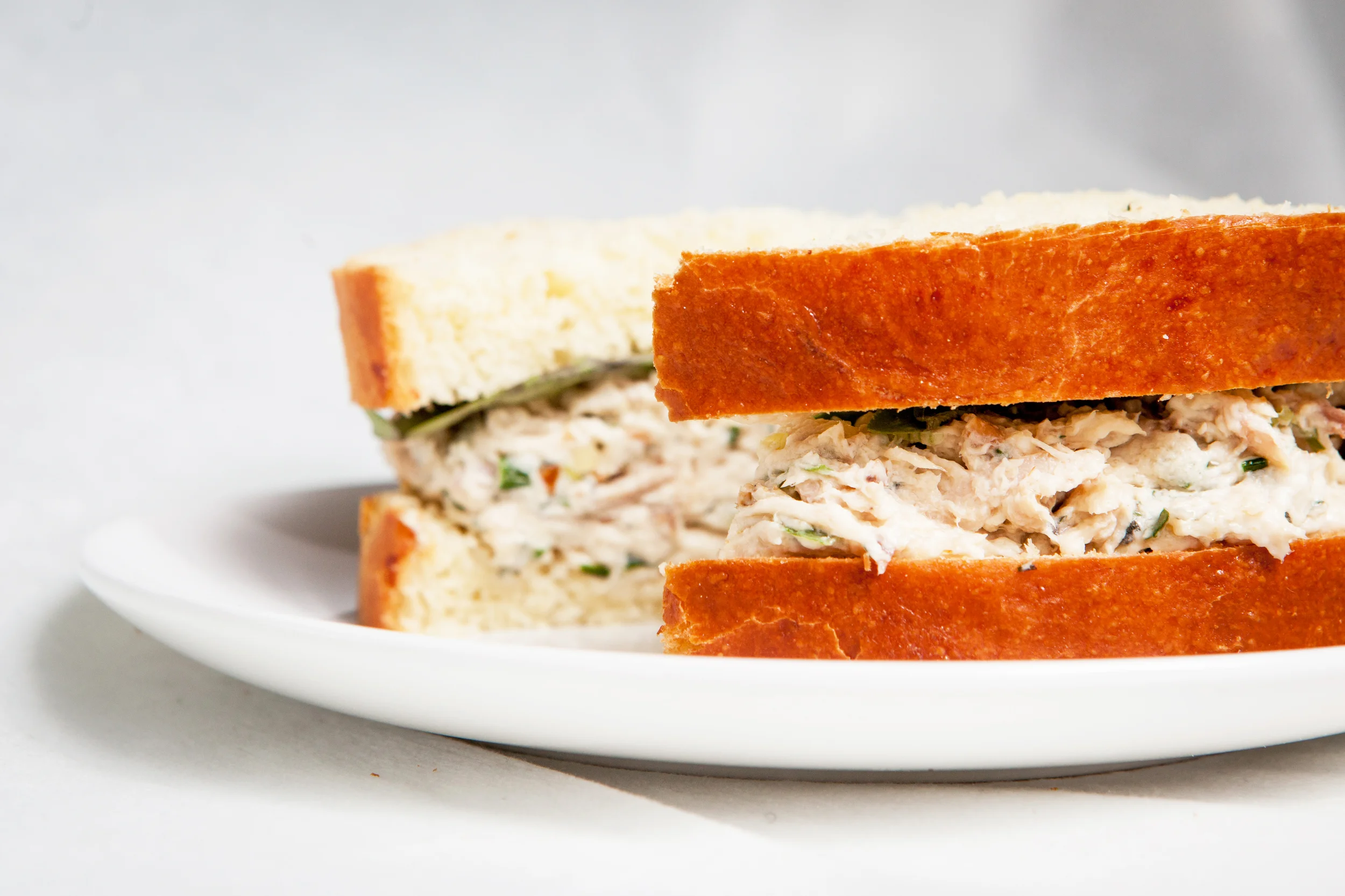 Roasted Chicken Salad Sandwich- $8.95 Local free-range roasted chicken, with fresh herbs in mayo between slices of pan au lait