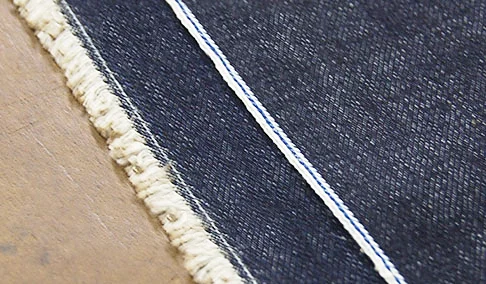 Shuttle Loom Selvedge atop Modern Loom Selvedge