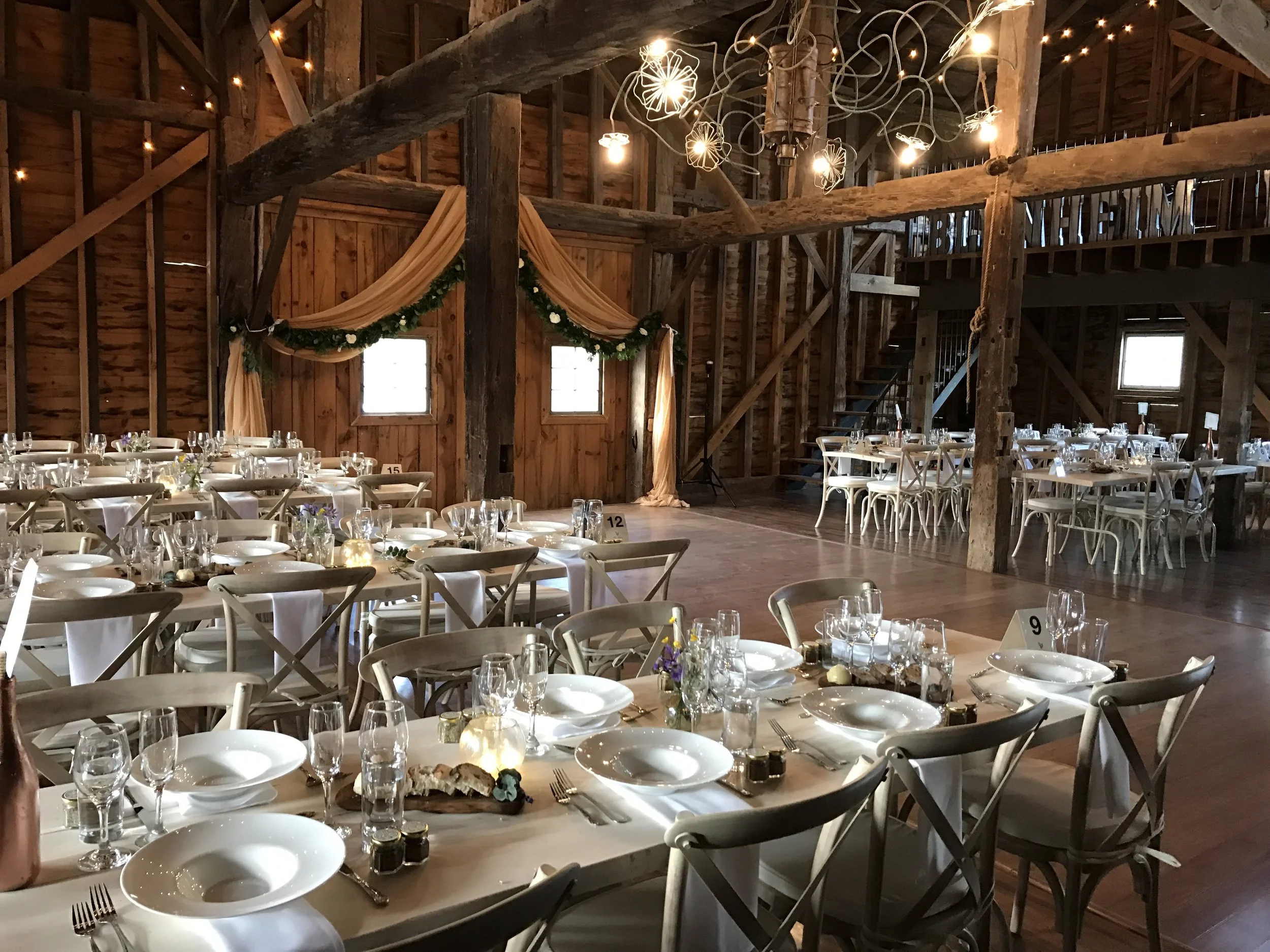 All handmade tables, white washed cross-back chairs, china and silverware is owned by the farm and included