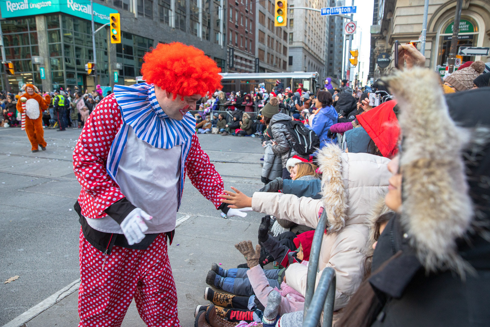 A Clown Giving The Kids a Hi-five