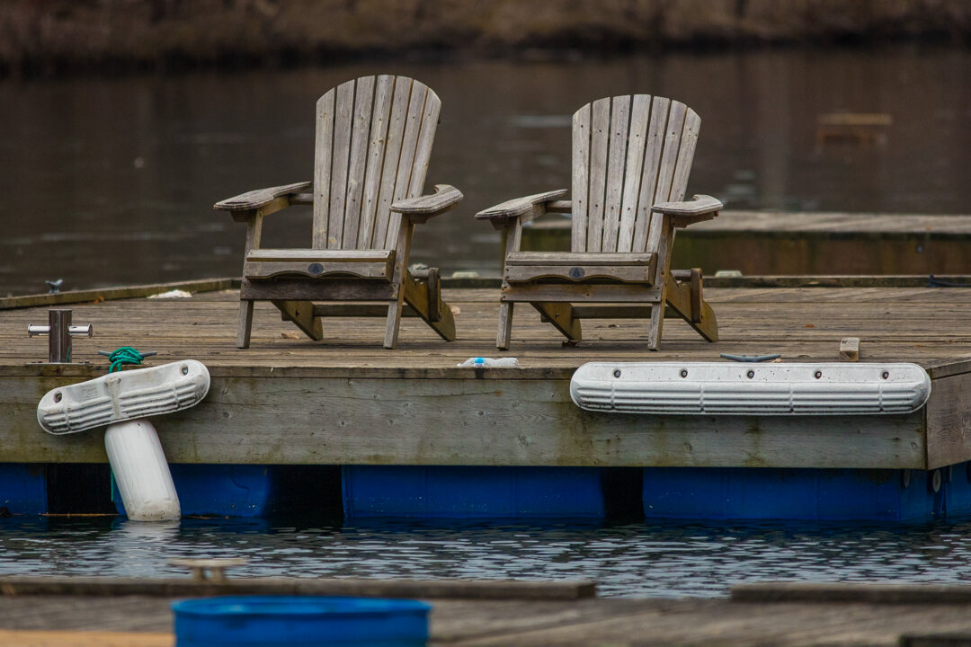  A pair of Muskoka chairs waiting for their owners to return. They may have a longer than usual wait.   