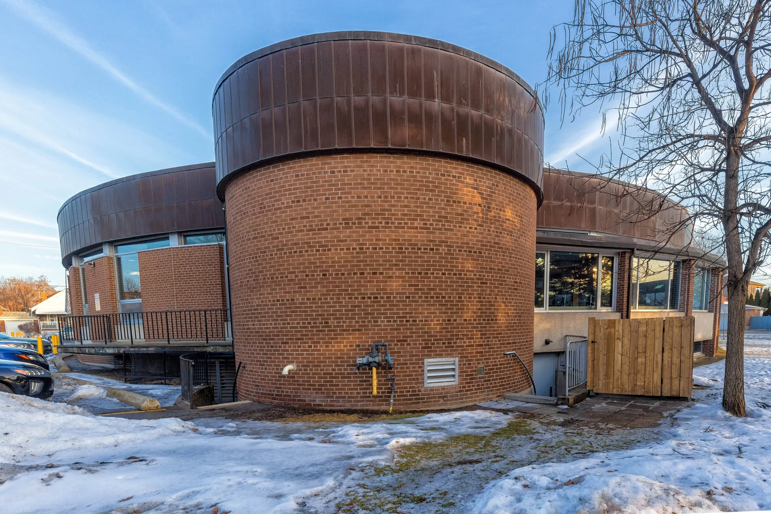 Rear view of S. Walter Stewart Public Library showing rounded brick sections in East York, Toronto, January 8