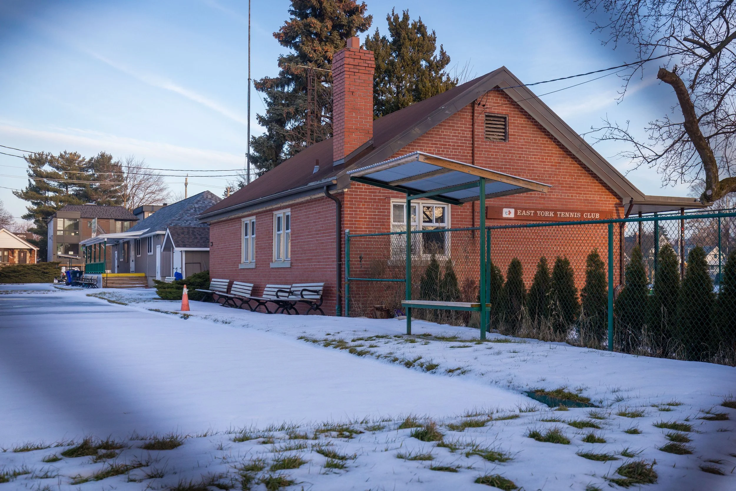 Clubhouse buildings at East York Tennis Club and East York Lawn Bowling Club in winter, Toronto.