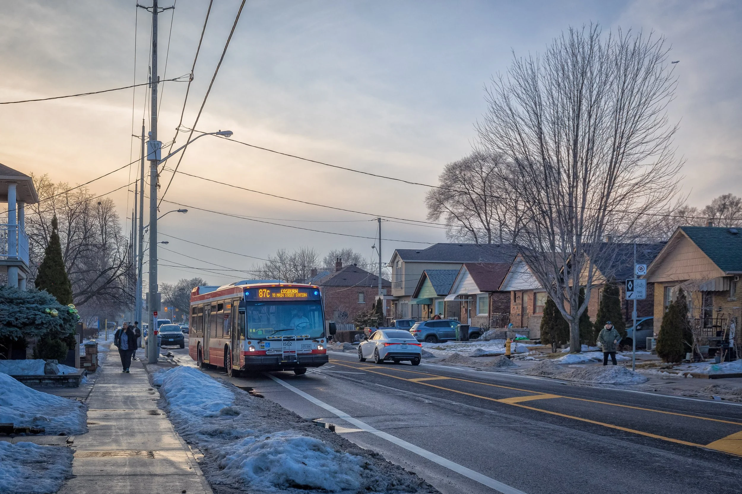 87 Cosburn TTC bus and residential streetscape along Cosburn Avenue in East York, Toronto.