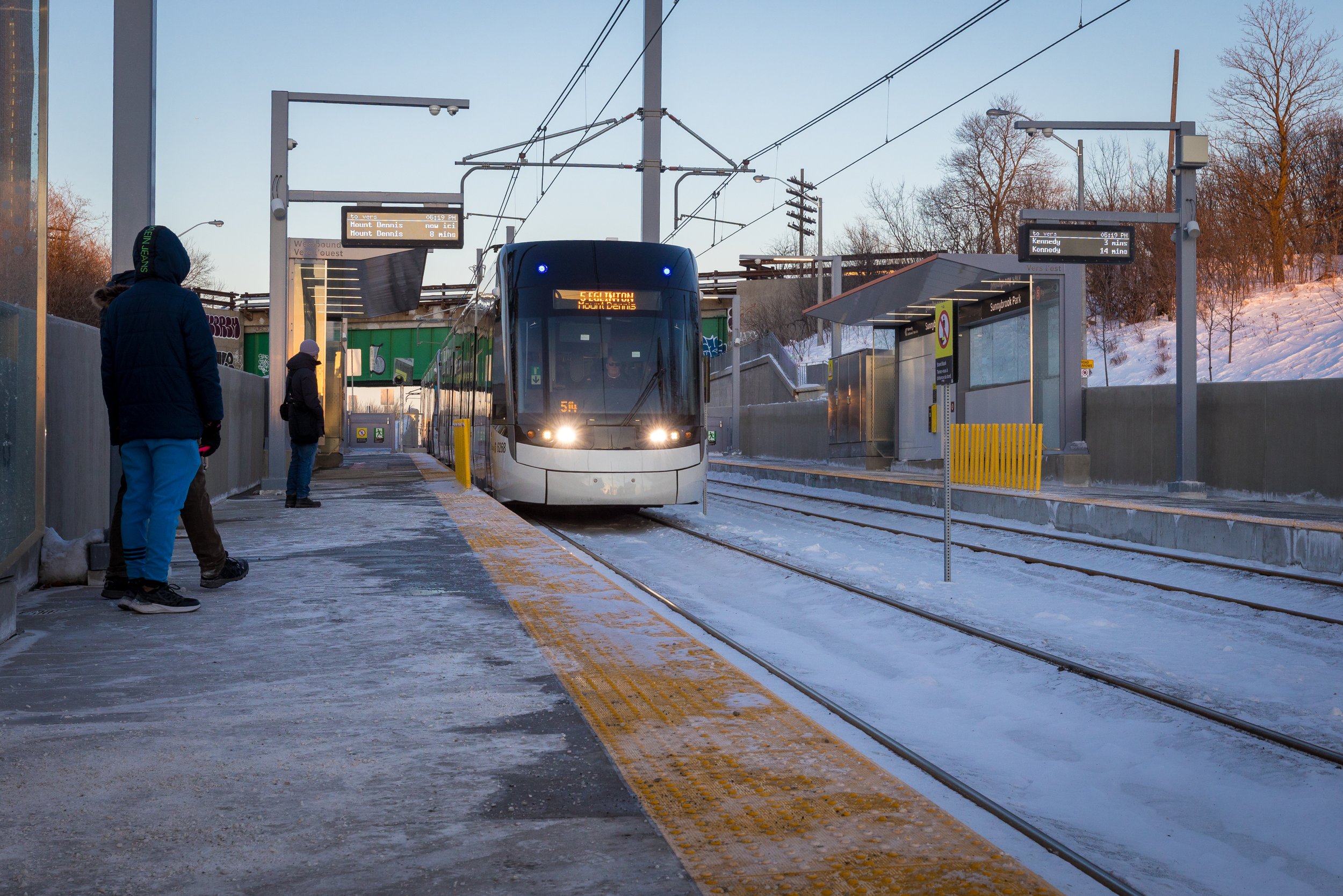  A Crosstown light rail vehicle approaches the platform. 