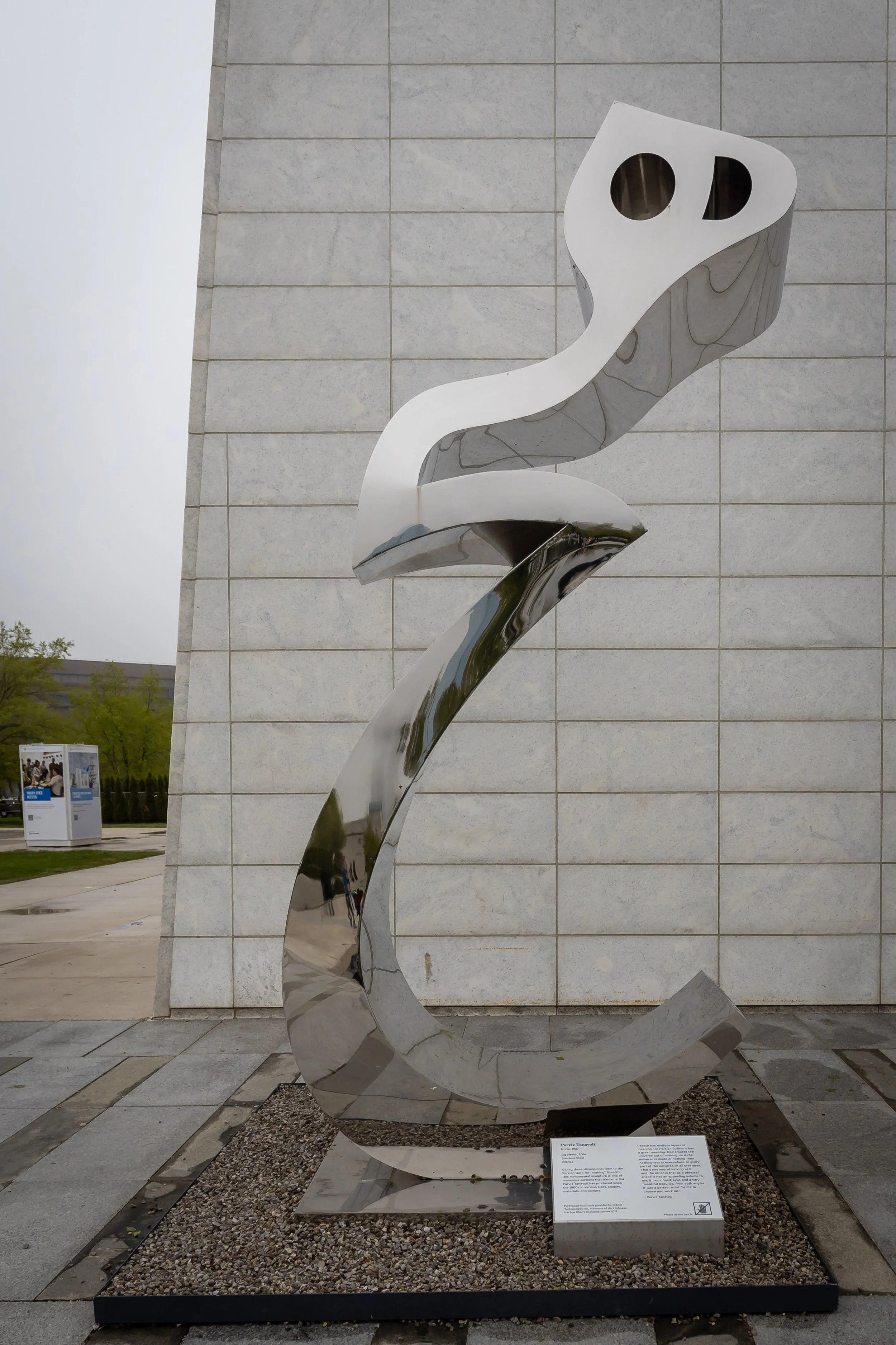 Polished steel sculpture Heech in a Cage by Iranian artist Parviz Tanavoli displayed outside the Aga Khan Museum.