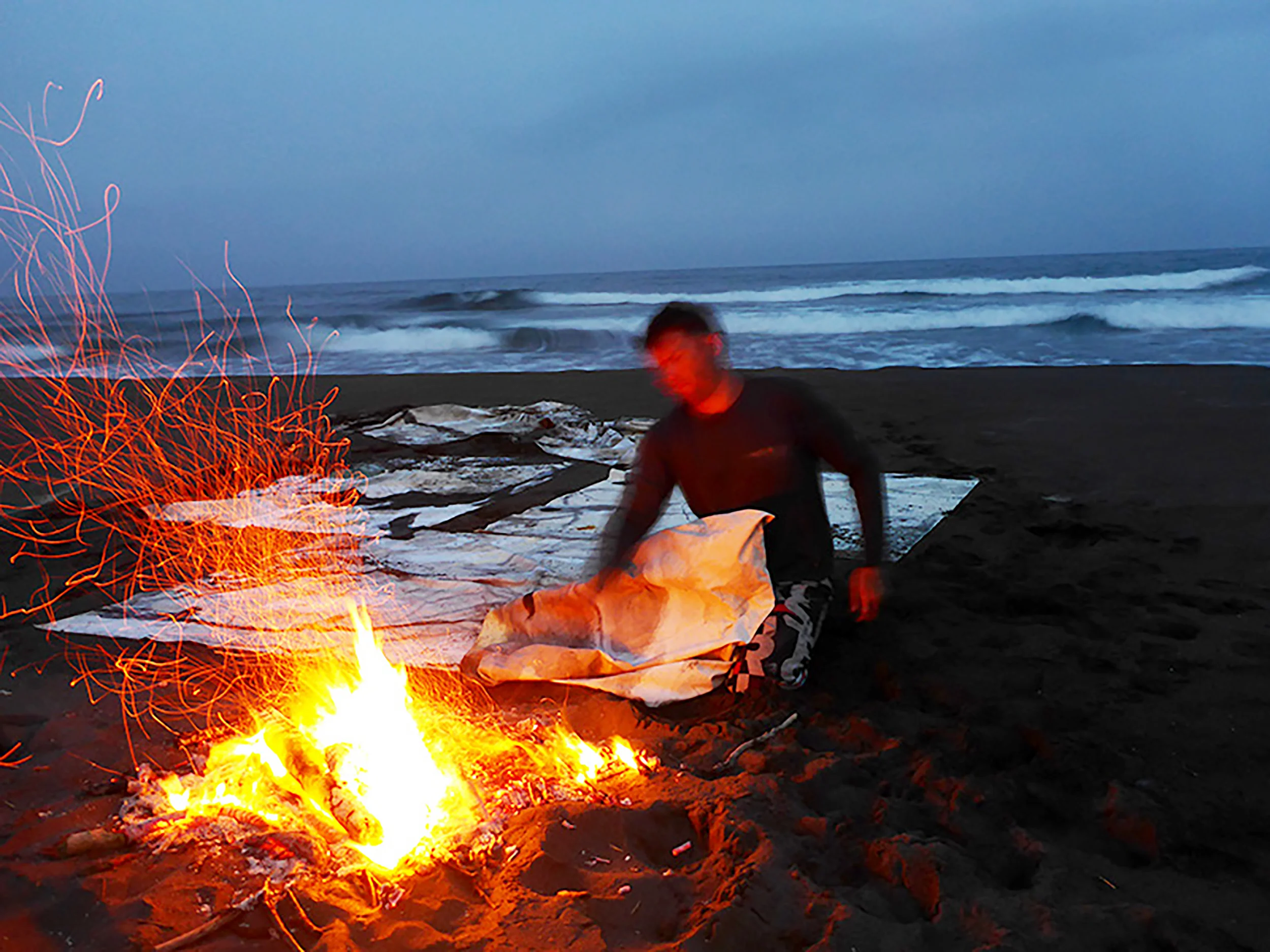 Drying the painting beside a driftwood fire on the Pacific coast of Taiwan, 2016