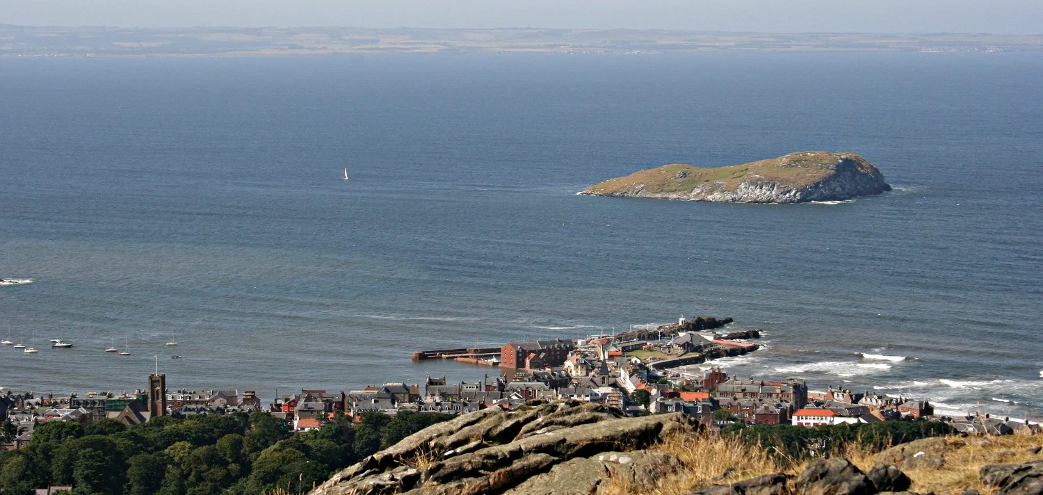 North Berwick town from the top of the Berwick Law, looking over the Firth of Forth to the distant Fife coast.