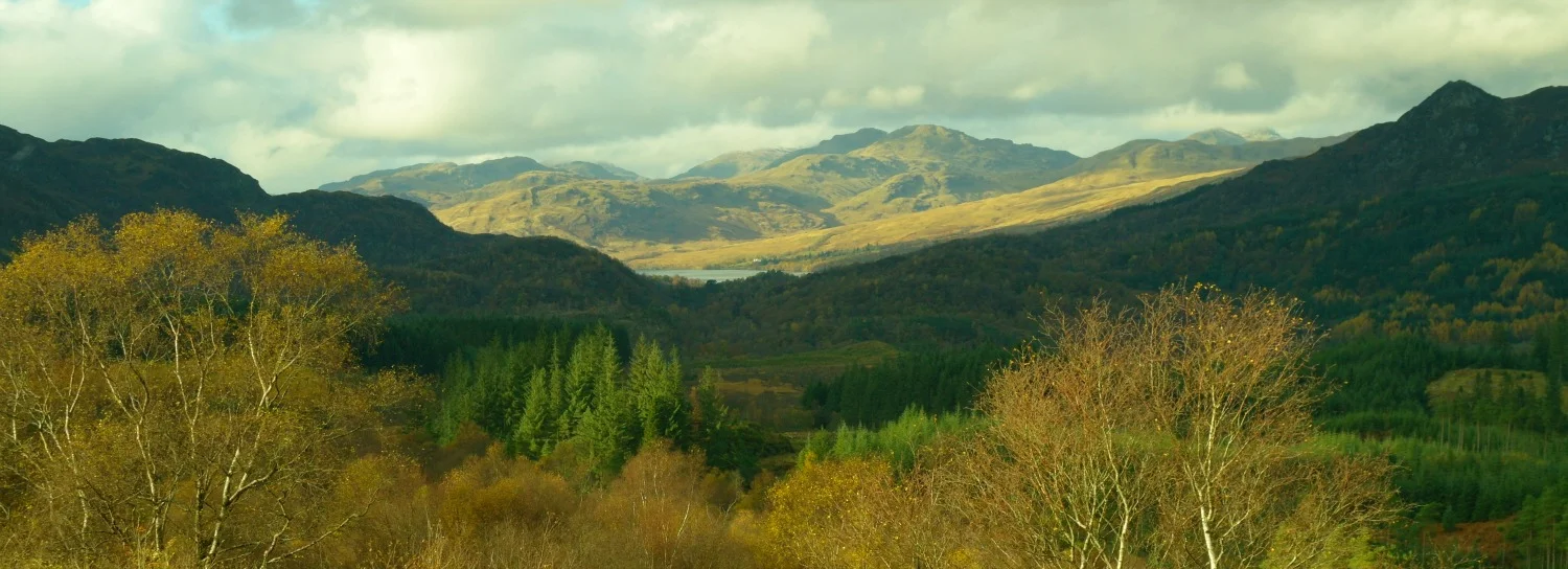 Looking towards distant Loch Katrine. Ben An in shadow, right.