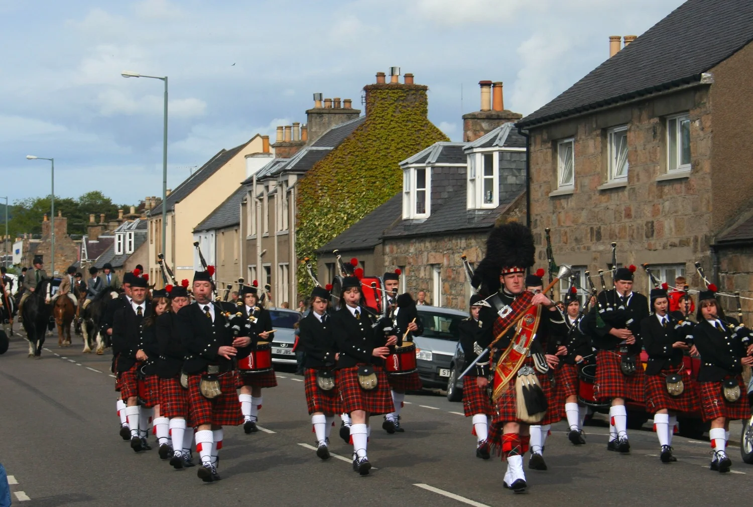 Dufftown Pipe Band march through Aberlour, Moray's shortbread capital.