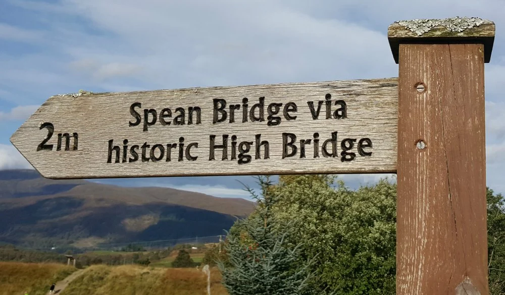 Look for the signpost on the west side of the Commando Memorial carpark, by the B8004 road.