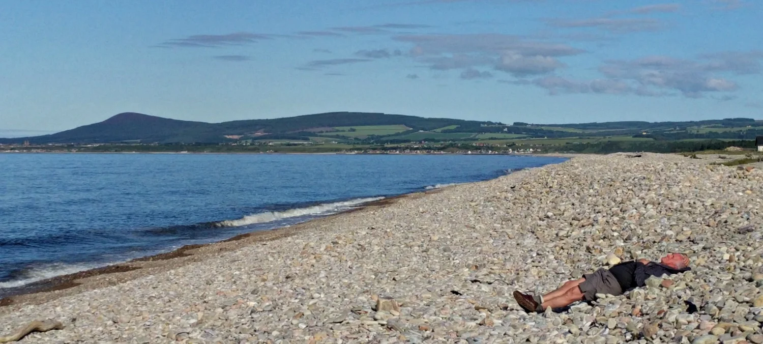 The countryside, especially the coast east of Inverness, by way of Moray and Aberdeenshire, can be quiet enough so that visitors are allocated a beach each on an individual basis. My friend here was lucky to get a last-minute cancellation, though he did find the big stones a bit uncomfortable.