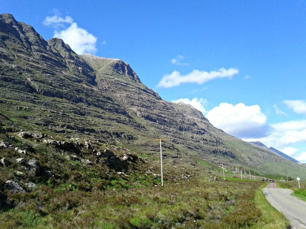 Looking east through Glen Torridon, where the spectacular mountain Liathach rises steeply from the roadside. Definitely on the Scotland must sees top listing for wild grandeur