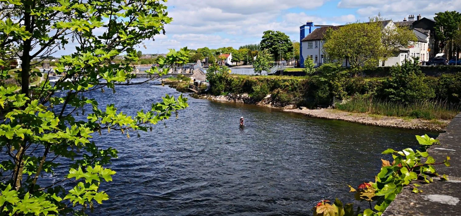 Wonder if he caught anything that day? Fishing on the Rover Corrib in the centre of Galway City.