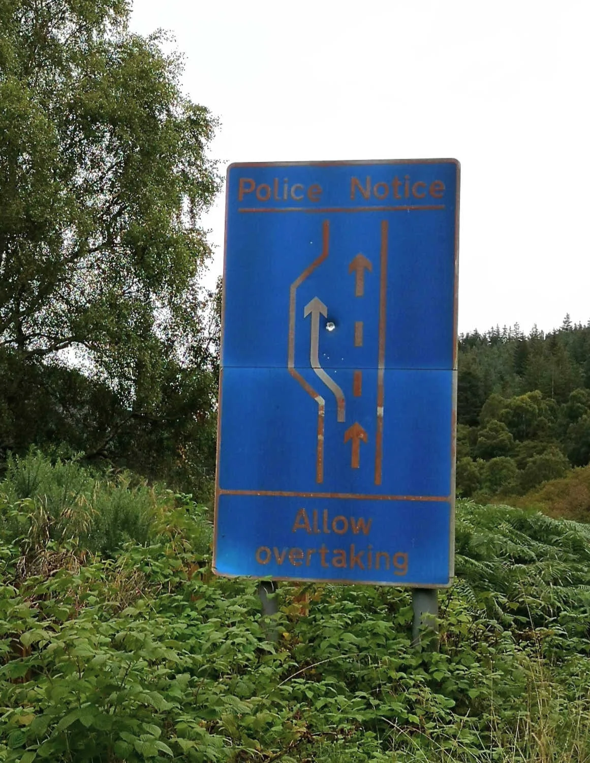 A somewhat faded official notice reminding you to allow faster-moving traffic behind you to overtake. Don’t mess about - just get into a passing place. Not identifying the location of this sign as it’s in a secluded glen that’s off the beaten track.