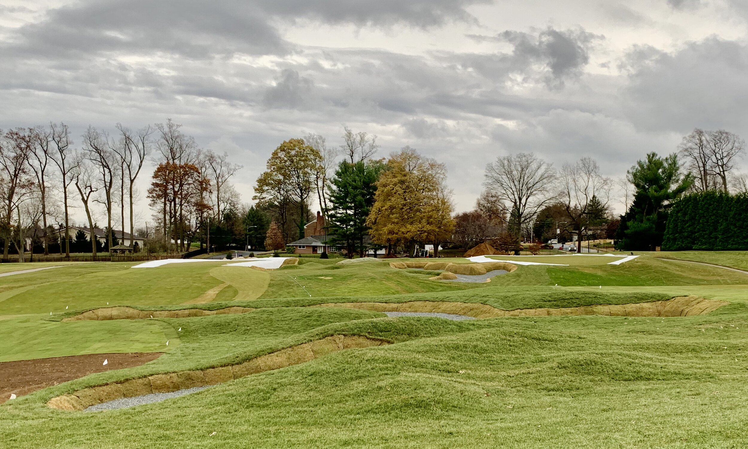 fairway mounding and bunkers between 1 and 3 fwy with 1 and 3 green in background