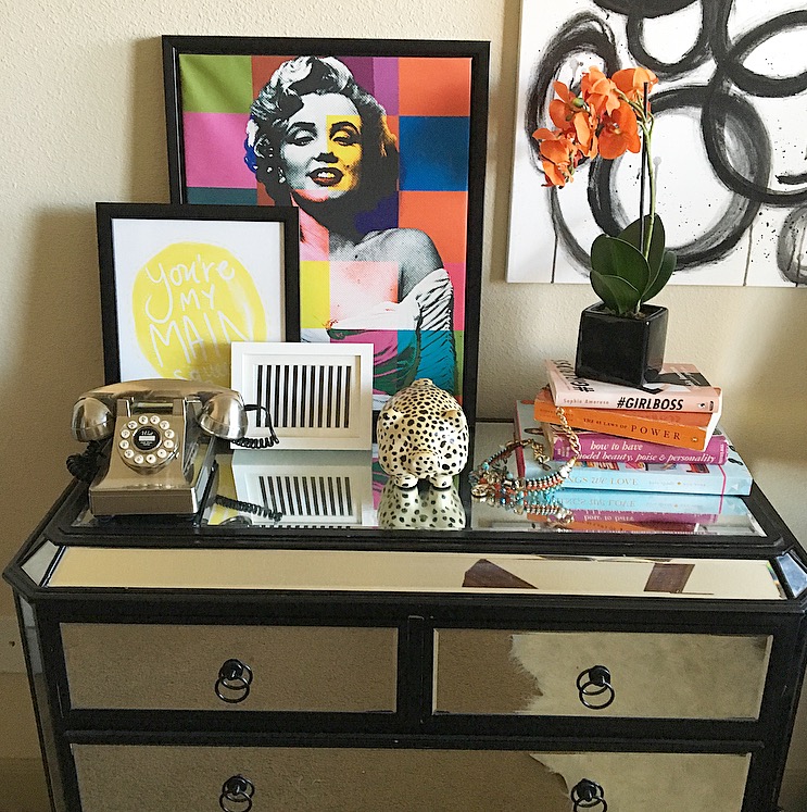 I've layered a couple of art work on my actual dresser , to prevent holes in the wall. But I do have a painting hanging in which I used the Command hanging strips.