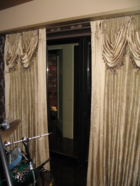 Drum Room to leather upholstered hallway
