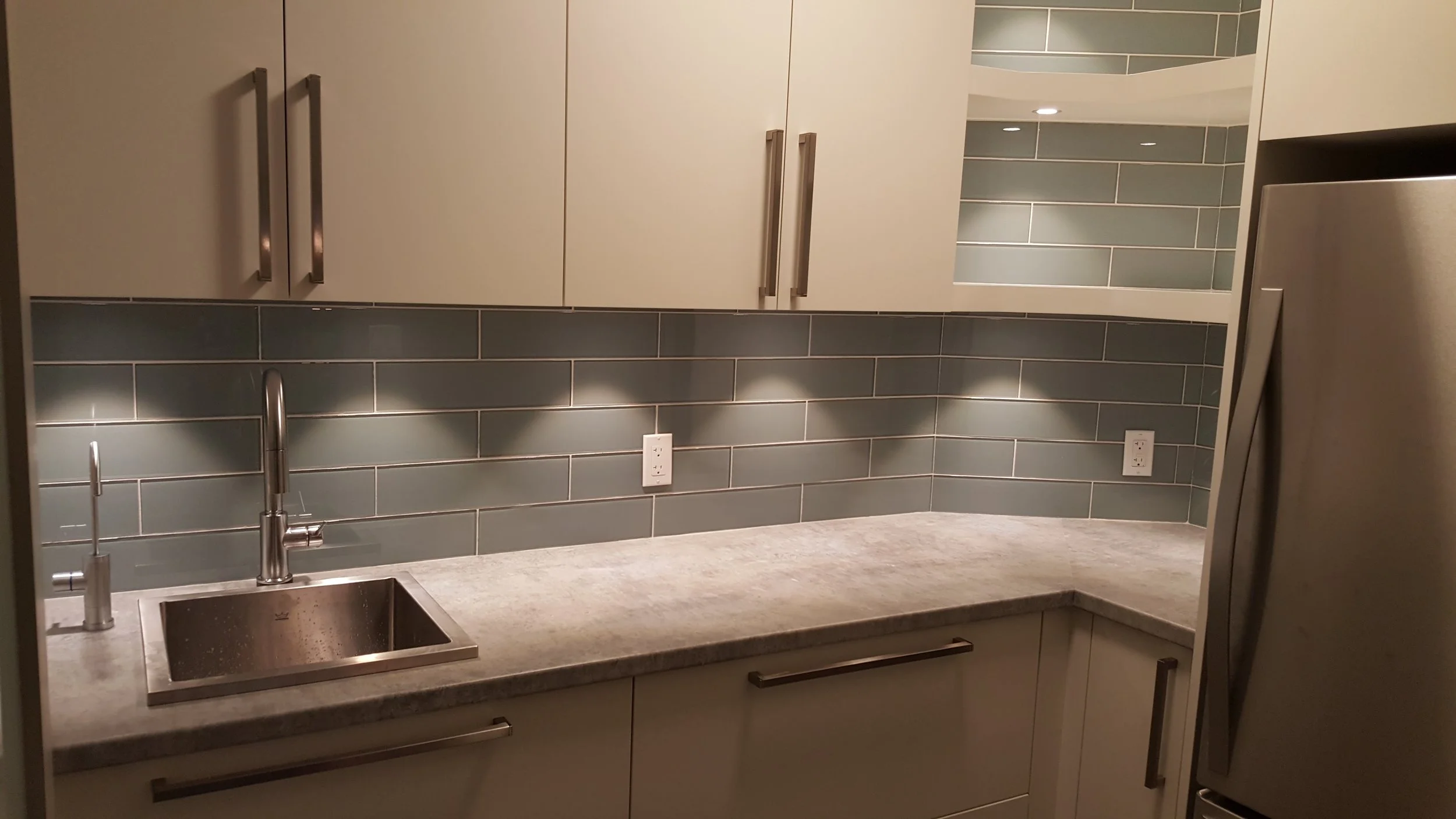 Pantry cabinetry with glass tile