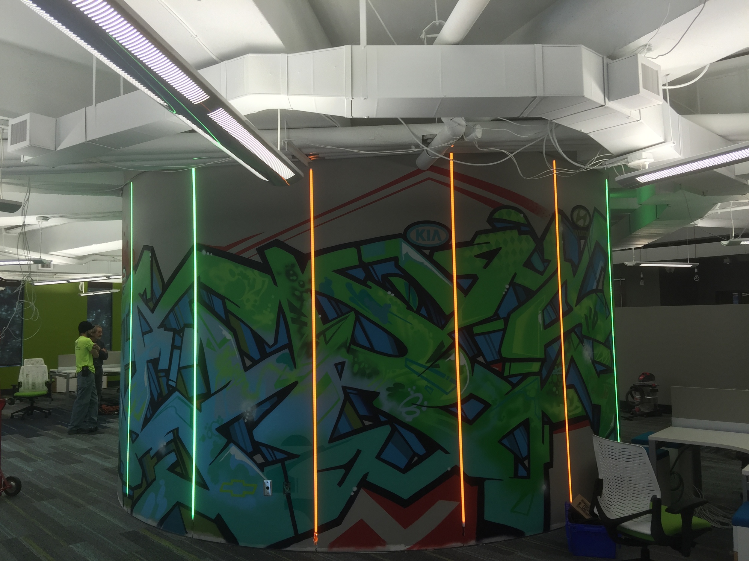 Strong Automotive's urban art within its Mountain Brook office. Embedded LEDcolor changing lighting add even more to this unique corporate art piece. 
